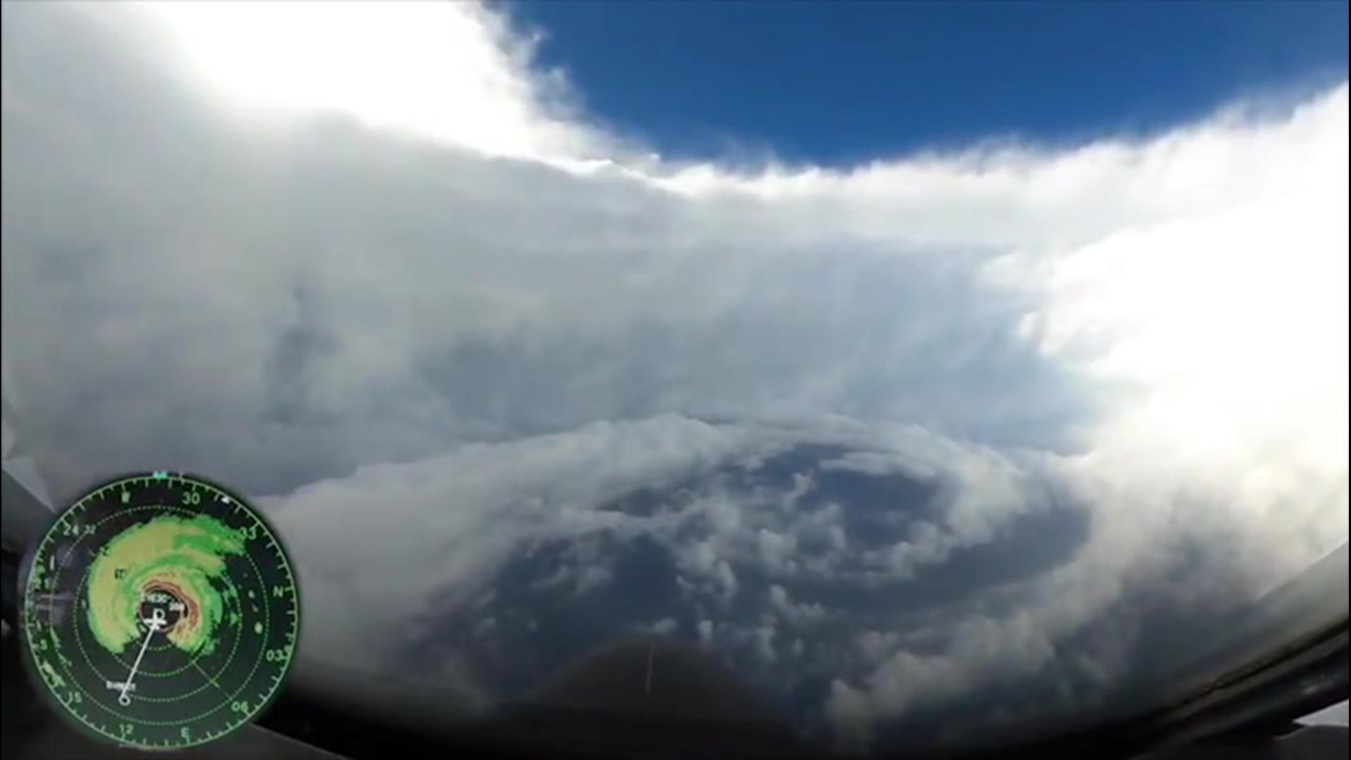 As Hurricane Hunters punched through Epsilon's eyewall on Oct. 21, they found themselves under a blue sky, surrounded by clouds that are sometimes described as the 'stadium effect.'