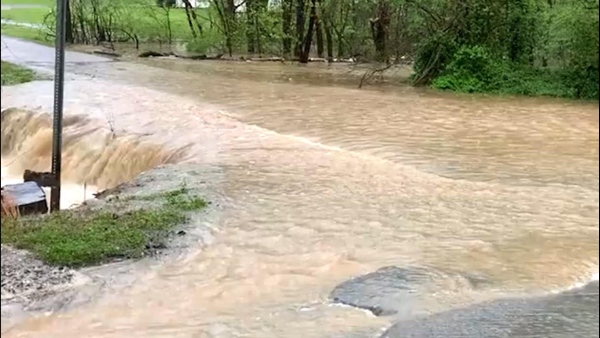 This road in Dalton, Georgia, gets swallowed by flash flooding in the midst of heavy rainfall on March 31.