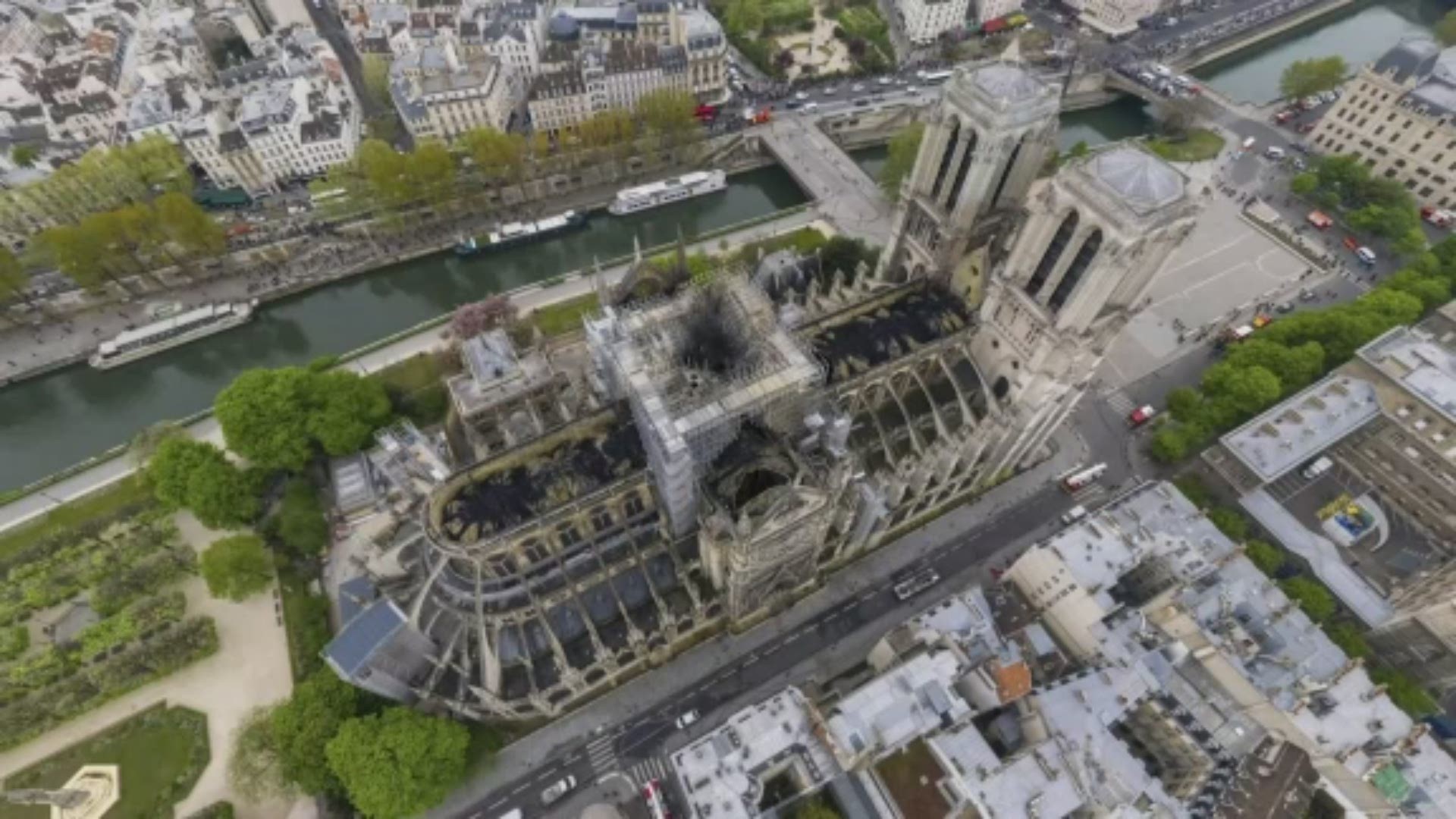 This 3D model contrasts an undamaged Notre Dame cathedral with a photo of the cathedral taken on April 16, 2019, the day after the fire. (AP)