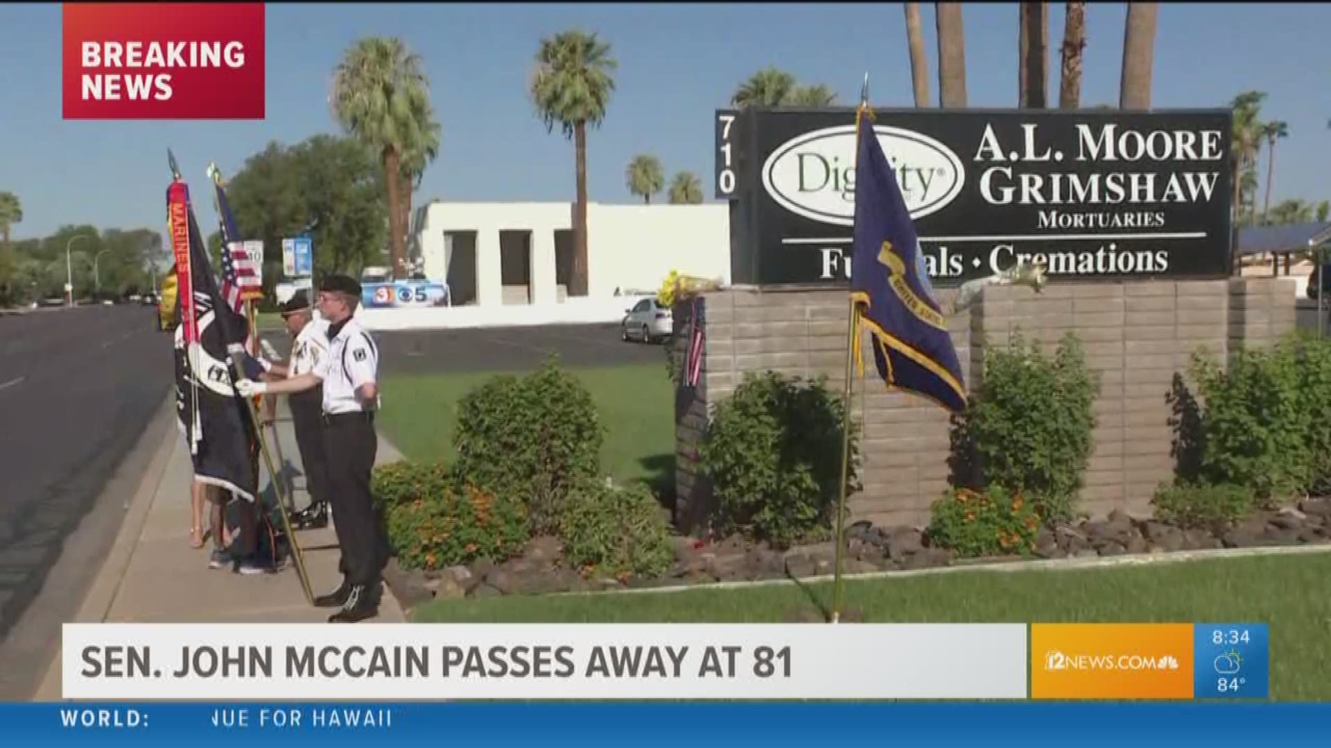 An honor guard will stand at attention outside the Phoenix mortuary as long as it has Sen. John McCain's body. People also lined the roads as the procession carrying his body made its way to Phoenix on Saturday night.