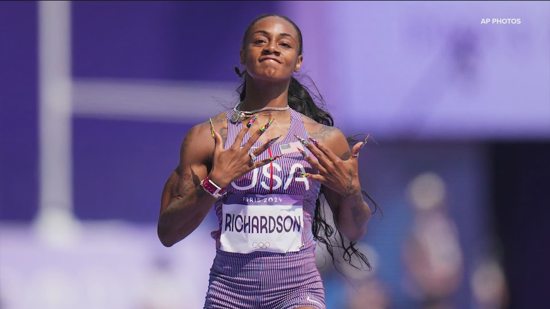 Wearing neon green shoes, which contrasted well against the bright purple track, she captured the first of eight first-round races on the opening day of track events