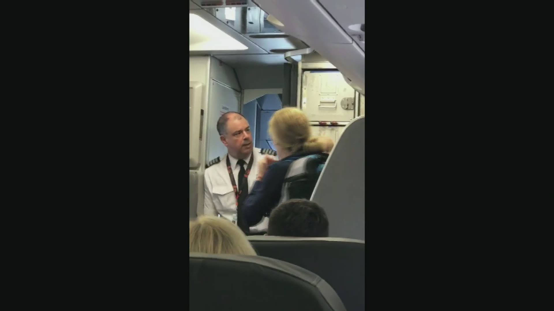 Raw video: Disturbance on American Airlines flight to DFW