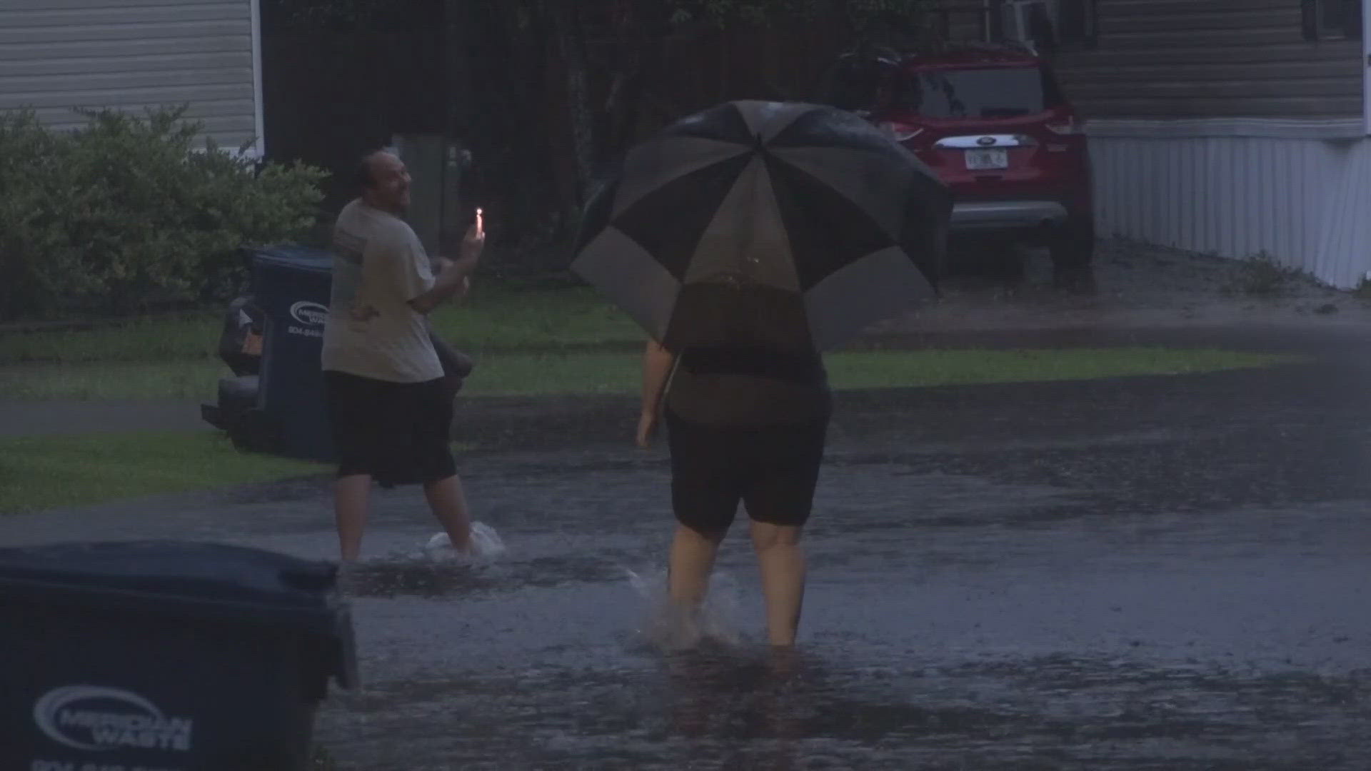 Don't try this at home, guys! Never get into floodwater.