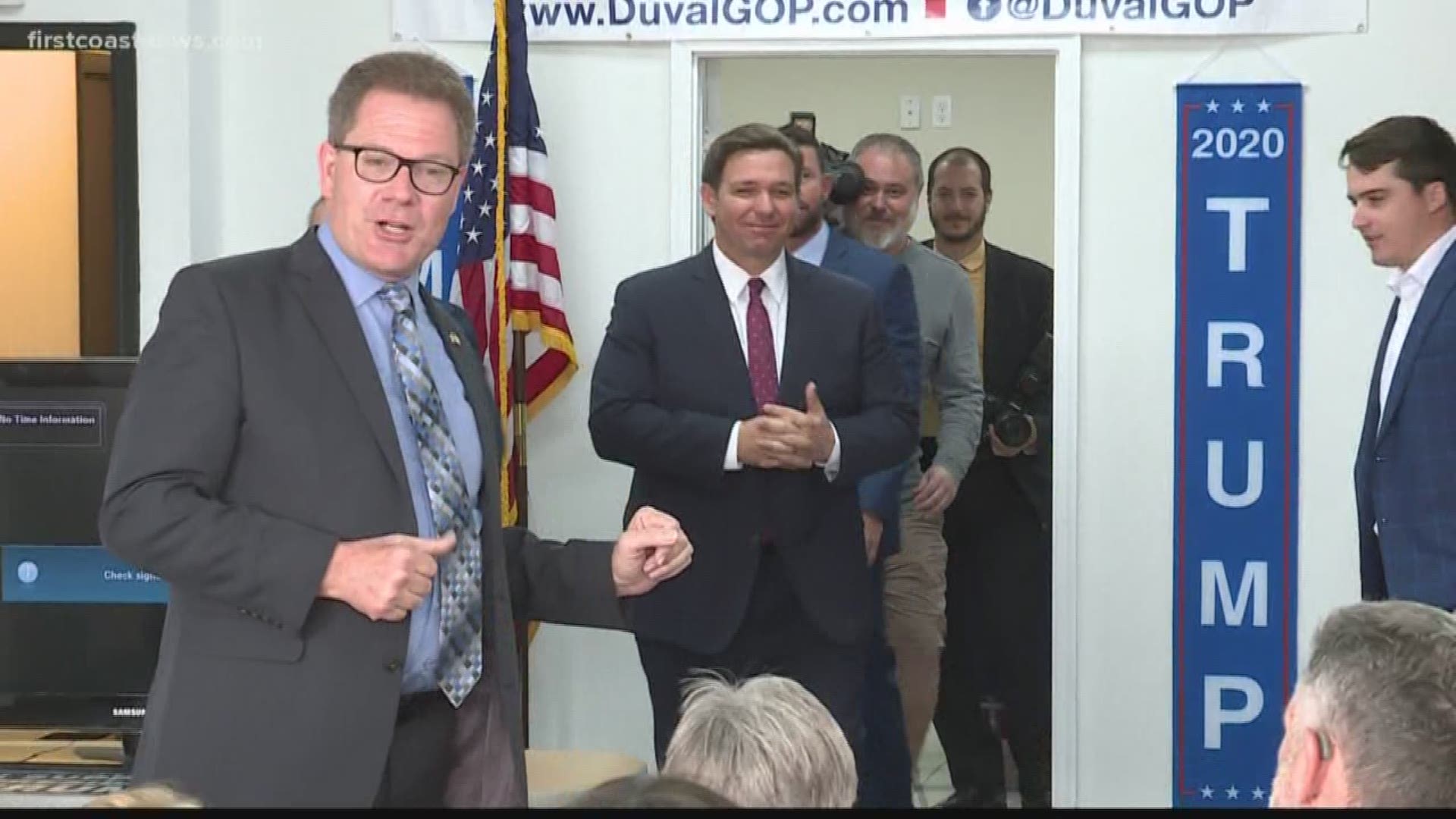 Florida Gov. Ron DeSantis surprised a group of Duval County Republican volunteers Wednesday with a bunch of "Keep America Great" hats signed by President Trump.