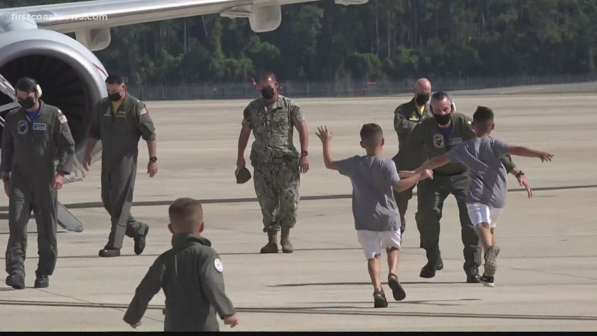 Wives, children, friends, and dogs gave hugs and kisses to their loved ones who've returned to NAS Jacksonville after deployment.