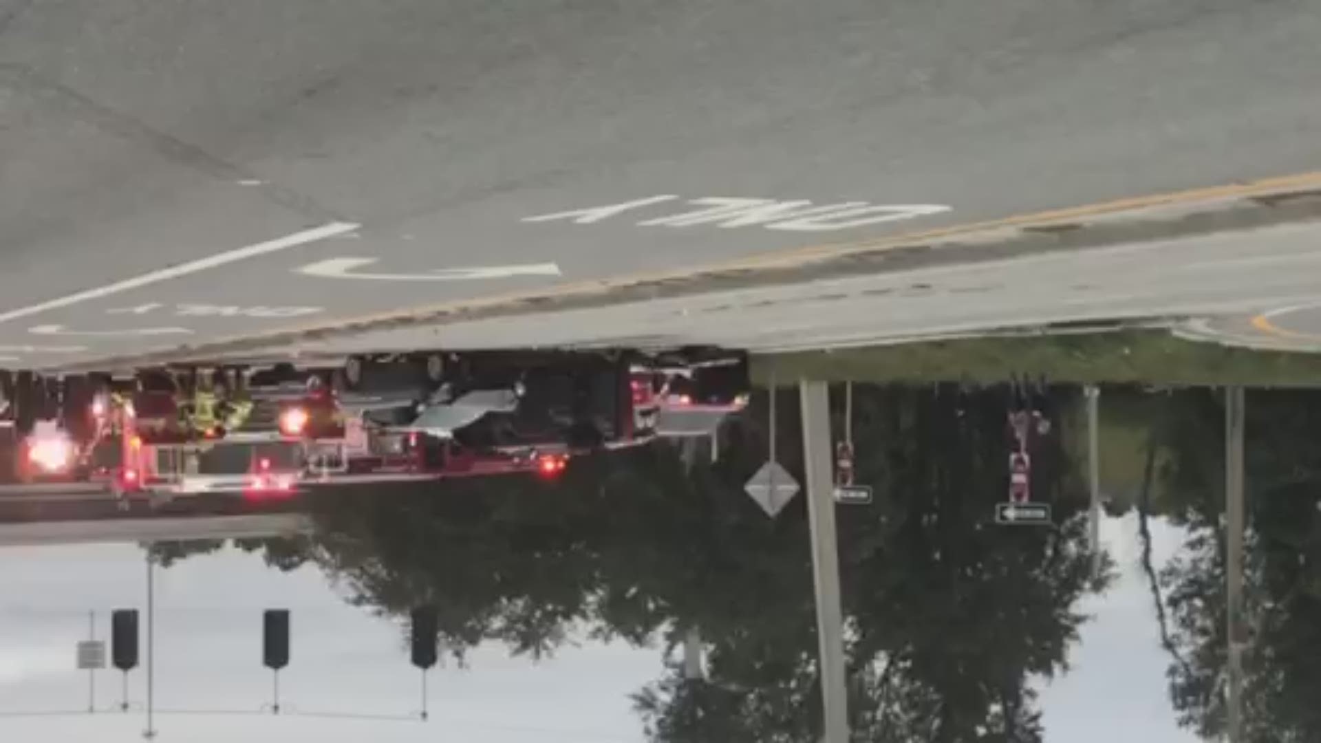 A car appears flipped onto its side in a crash on San Jose Boulevard and Interstate-295 in Jacksonville.