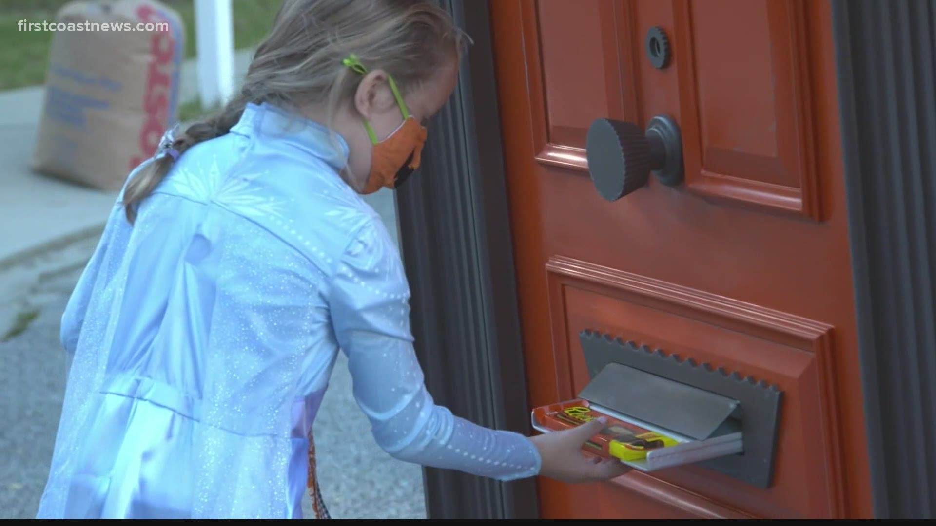 The candy maker created a trick-or-treat door designed to roll through neighborhoods to dispense chocolate.