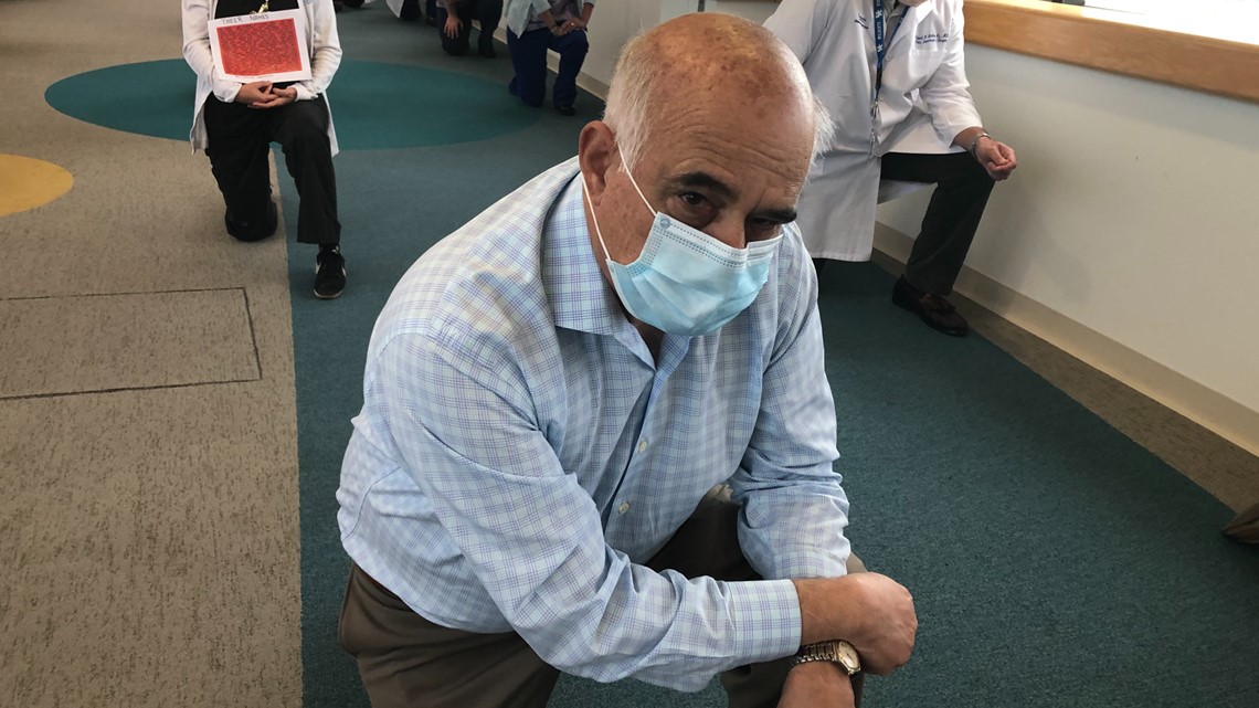 White Coats for Black Lives Jacksonville doctors kneeling in