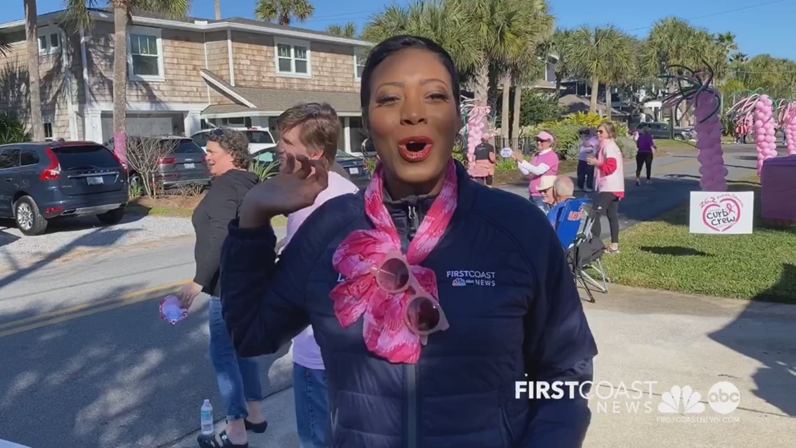 First Coast News' Keitha Nelson and Brooks Baptiste help cheer on runners during 26.2 DONNA Marathon