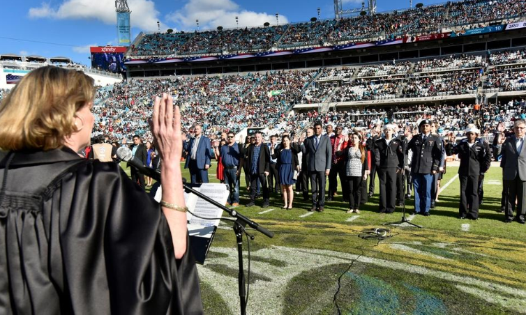 51 new Americans take the oath of citizenship at Jaguars game