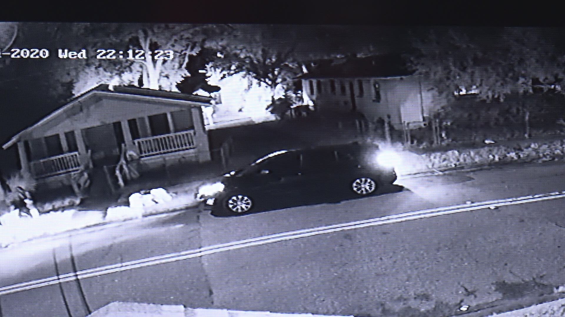In the video obtained by First Coast News, a man can be seen peering out from behind a home at an unmarked vehicle parked out front.