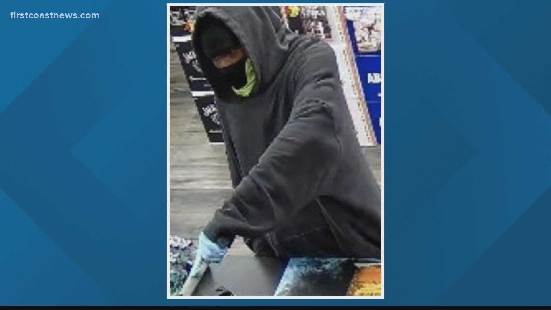 Officers say the person pictured entered a business, displayed a firearm and demanded money from the employees.