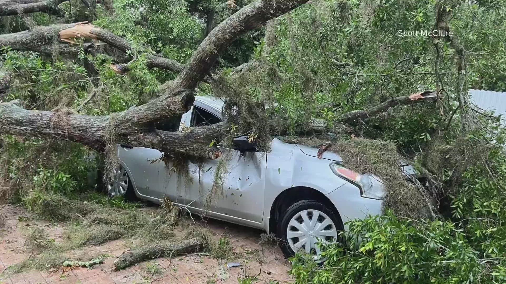 Cars, roads and property were strucfk by strong storms Friday morning.