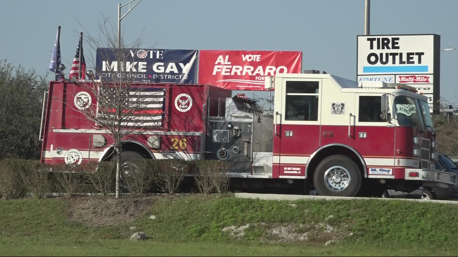 erry Bork sent us a photo of a fire truck sitting in the parking lot of a tire store on Merrill Road with multiple campaign signs.