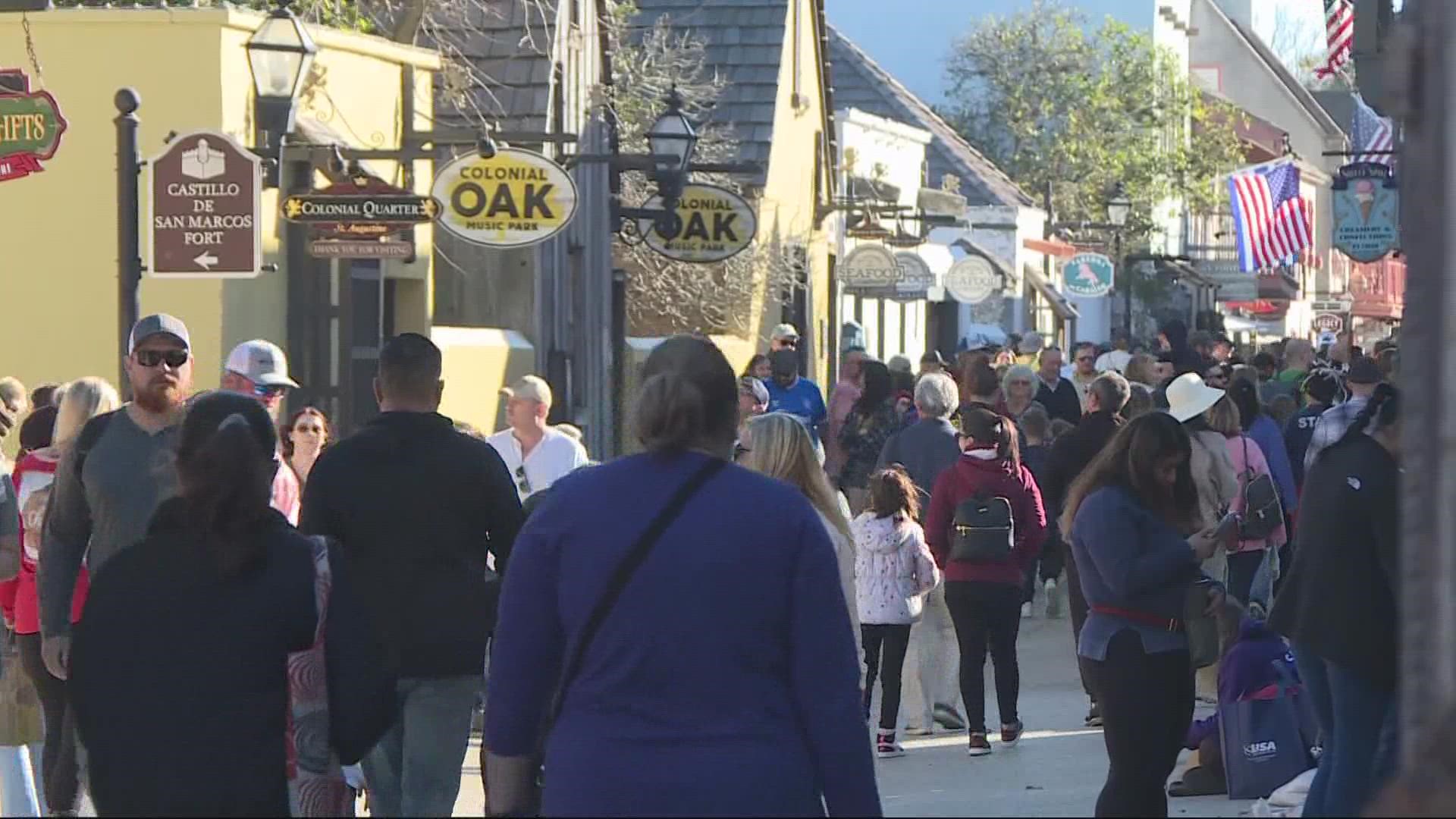 People are willing to cram into trams, parking lots, and pathways for a taste of St. Augustine at the holidays.