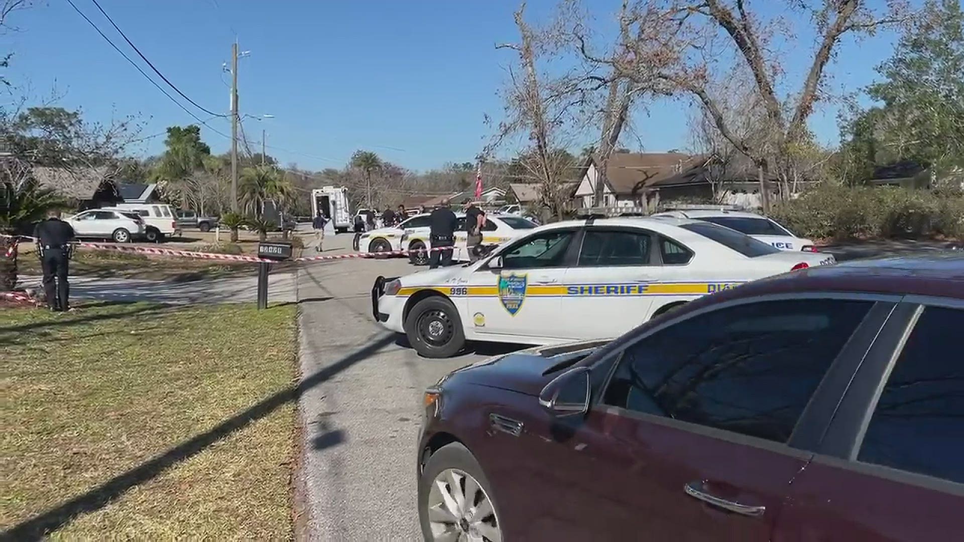 The Jacksonville's Sheriff's Office Bomb Squad unit is back on Toucan Drive, where hours earlier a suspect engaged in a standoff with police. Credit: Jerry McGovern
