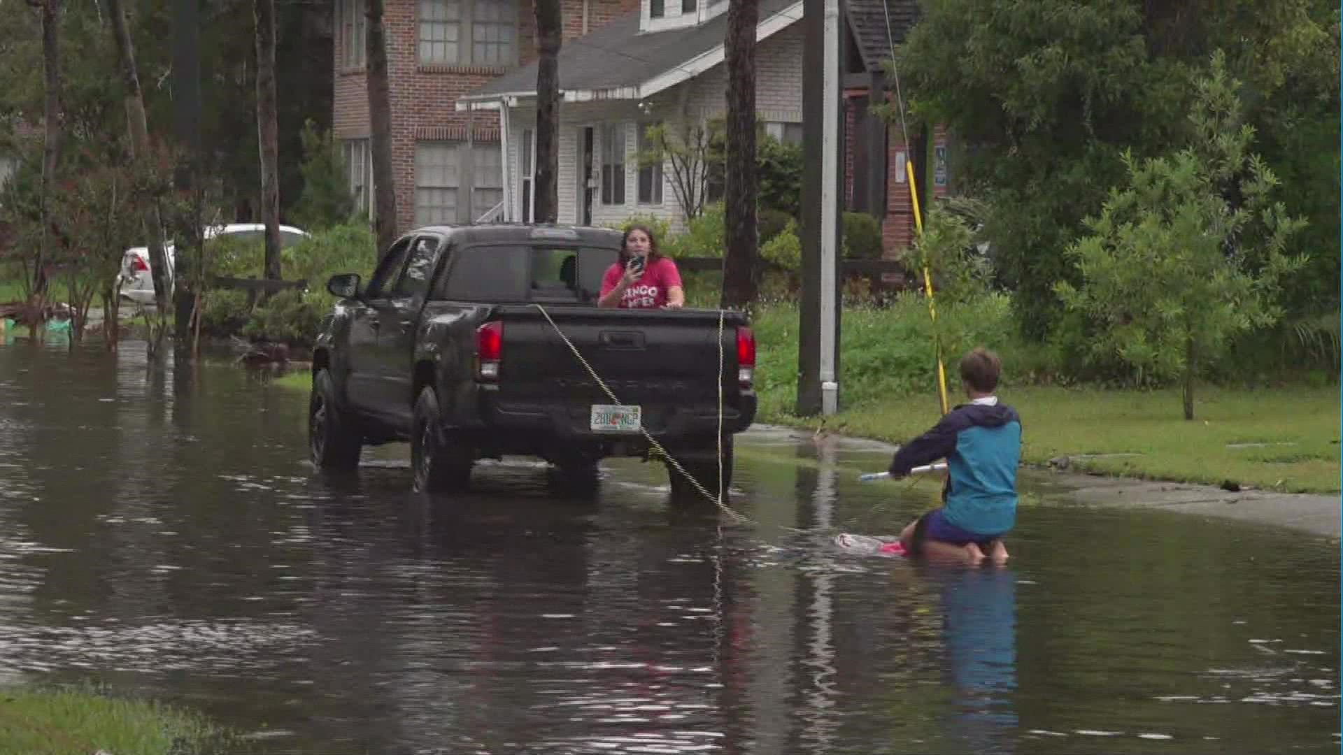 A man decided to ride out Hurricane Ian Wednesday on a Kneeboard cruising the streets of San Marco in Jacksonville.