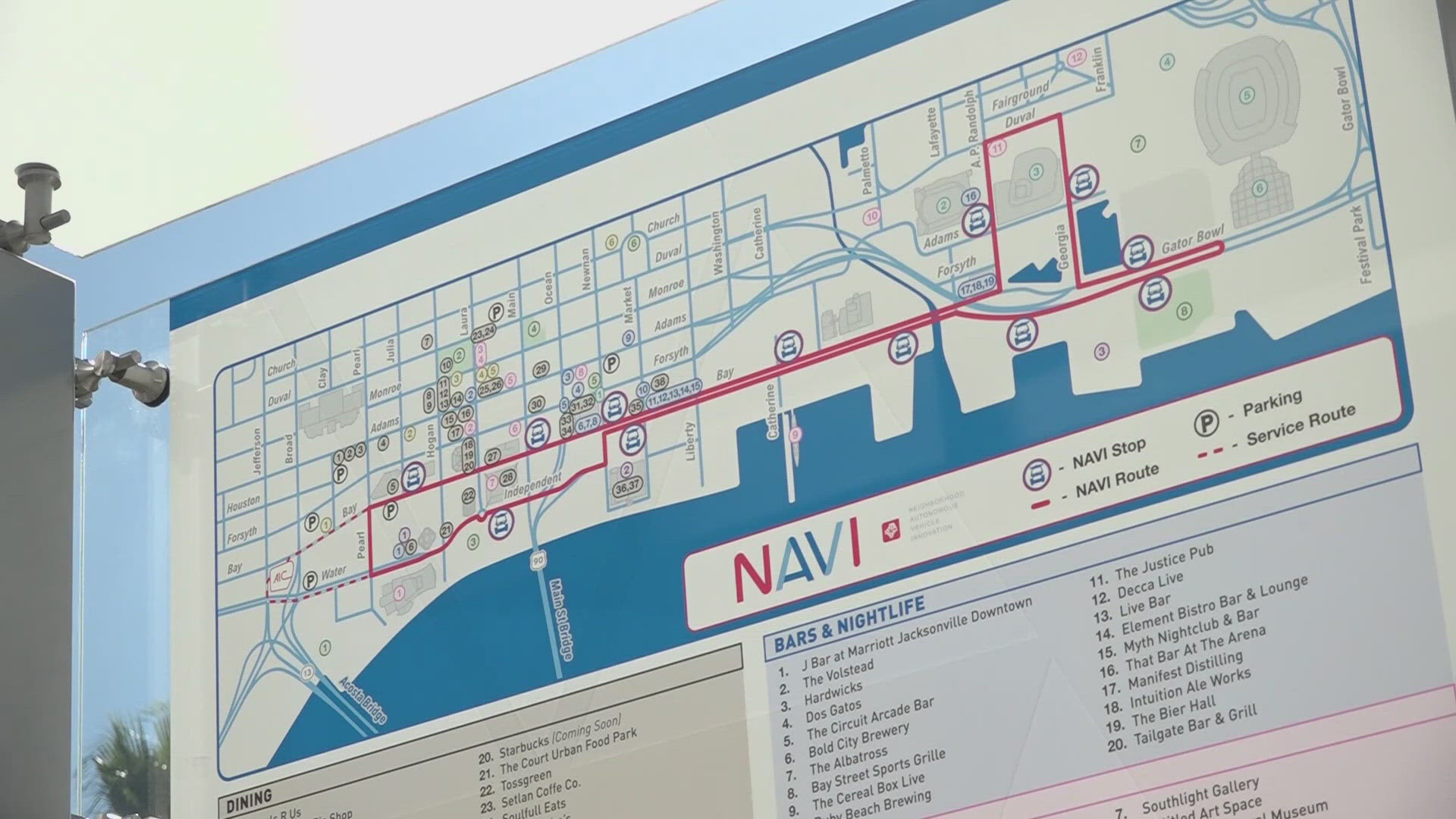 Jacksonville’s self-driving shuttle program, known as NAVI, is under review by the Duval DOGE Committee as city leaders raise new questions. 