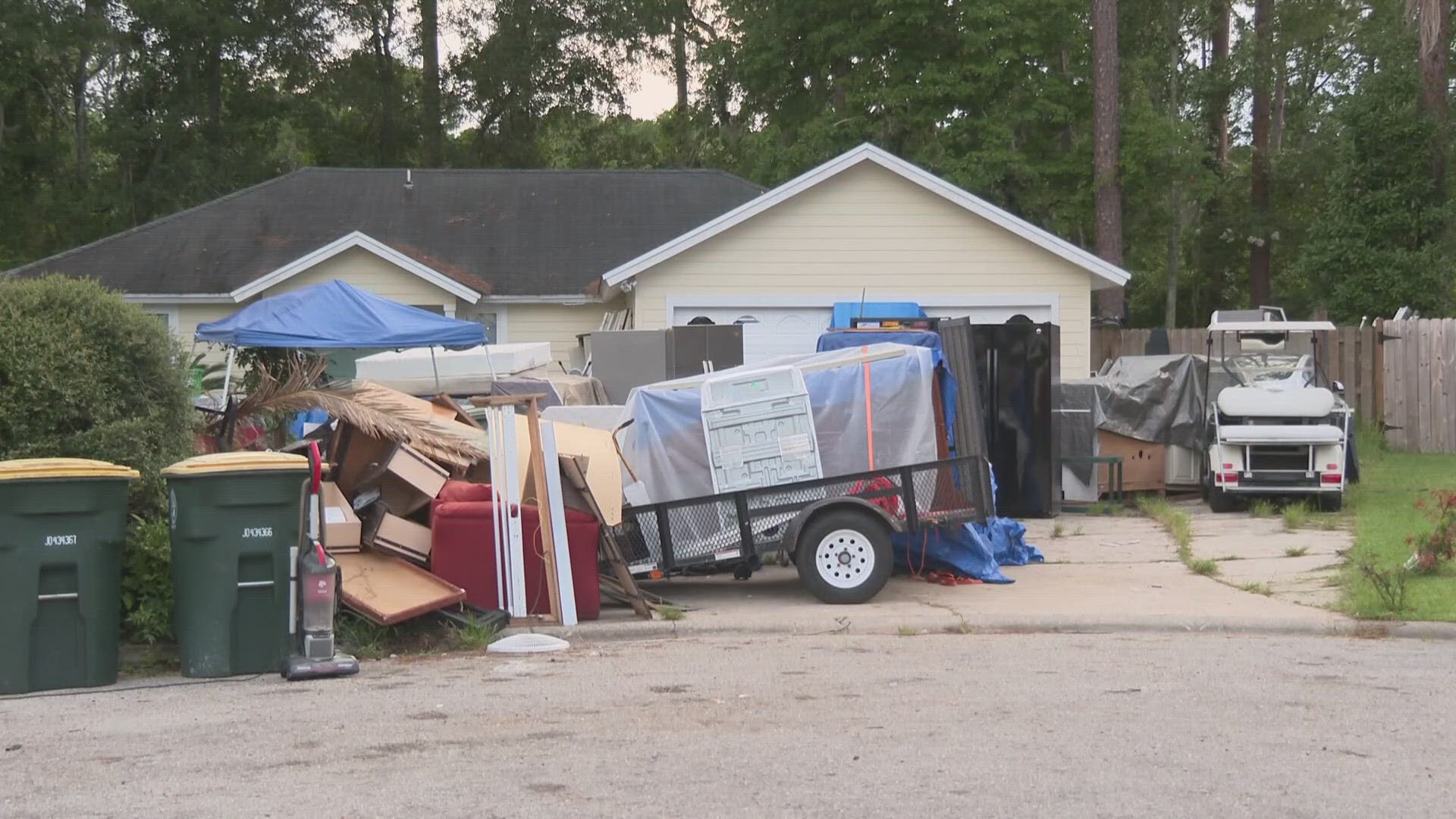 Dennis and Susan Philipps are tired of seeing mattresses, refrigerators, and even a damaged Tesla in their neighbor's front yard.