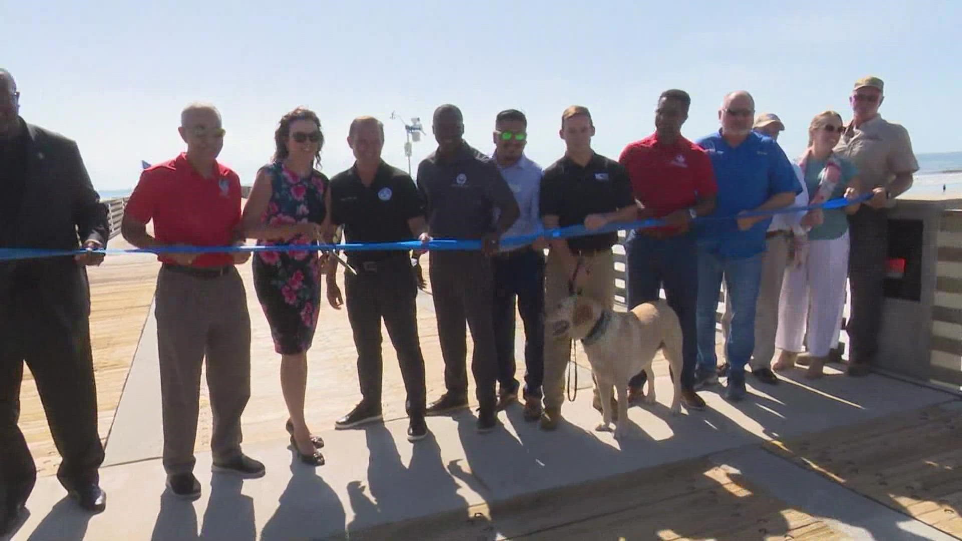 Mayor Lenny Curry and Mayor Christine Hoffman broke out a pair of ceremonial scissors for the ribbon cutting to re-open Jacksonville Beach Pier.