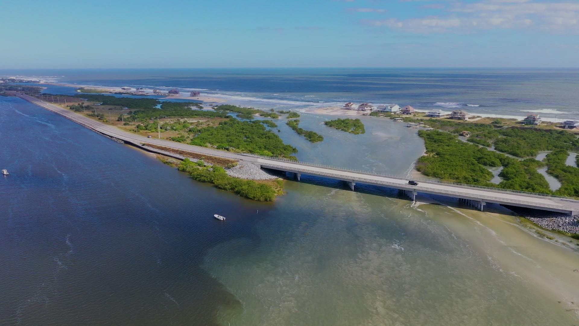 Drone footage shows homes along the beach between Matanzas Inlet and Marineland nearly surrounded by water after a breach in St. Johns County.
