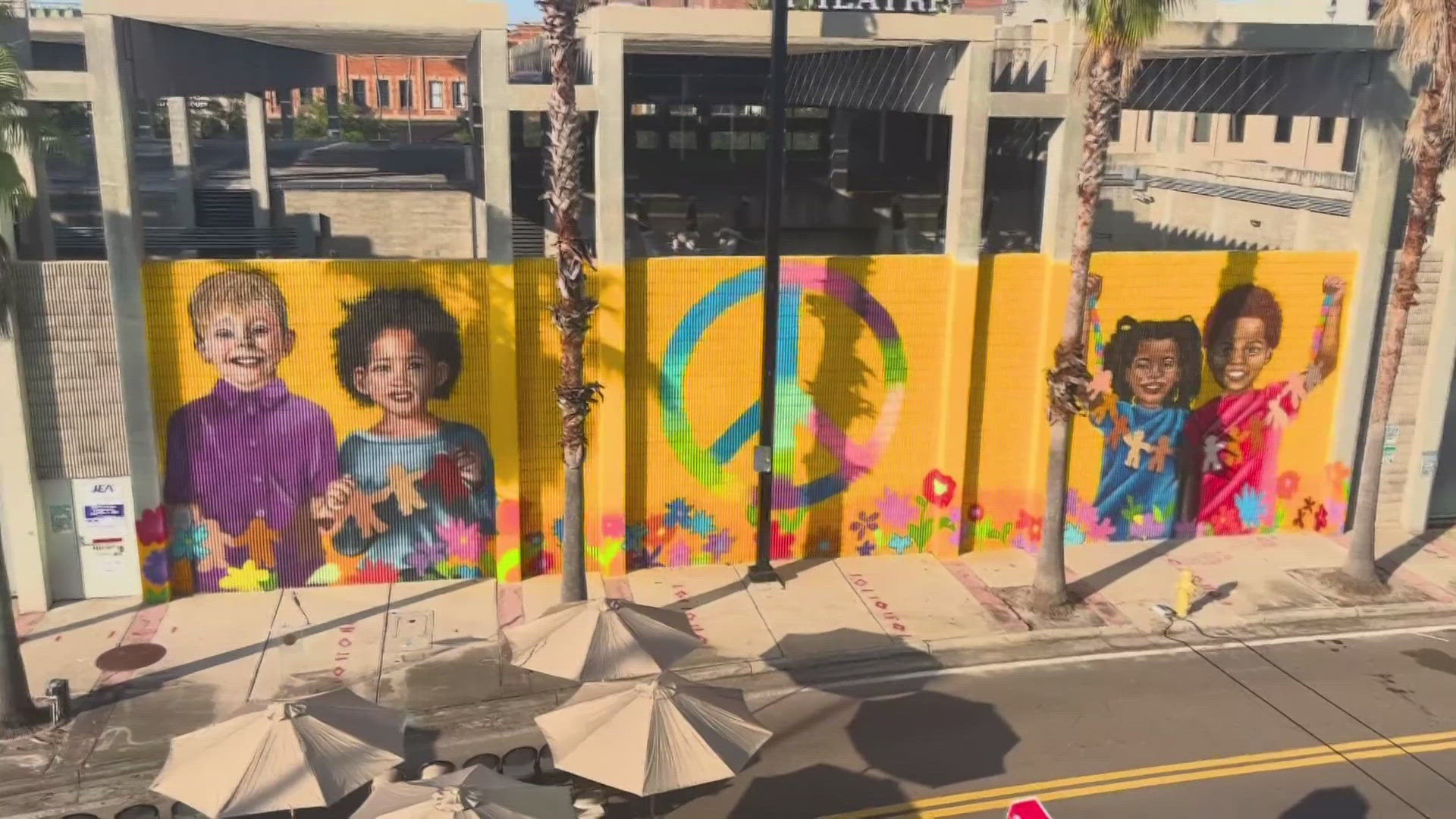 As a way to heal from one of Jacksonville’s darkest days, a street corner is now painted bright.