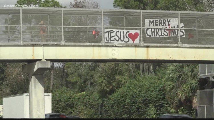 'God said to spread joy on I-95': Man explains why he hangs signs, waves from Jacksonville overpass