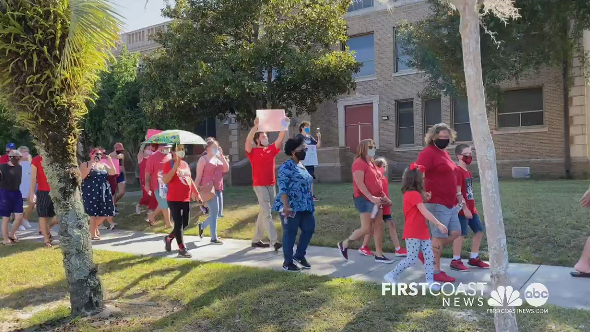 Two groups of teachers held a caravan from Andrew Jackson High School to Evergreen Cemetery, an act of symbolism over possible COVID-19 deaths if schools reopen.