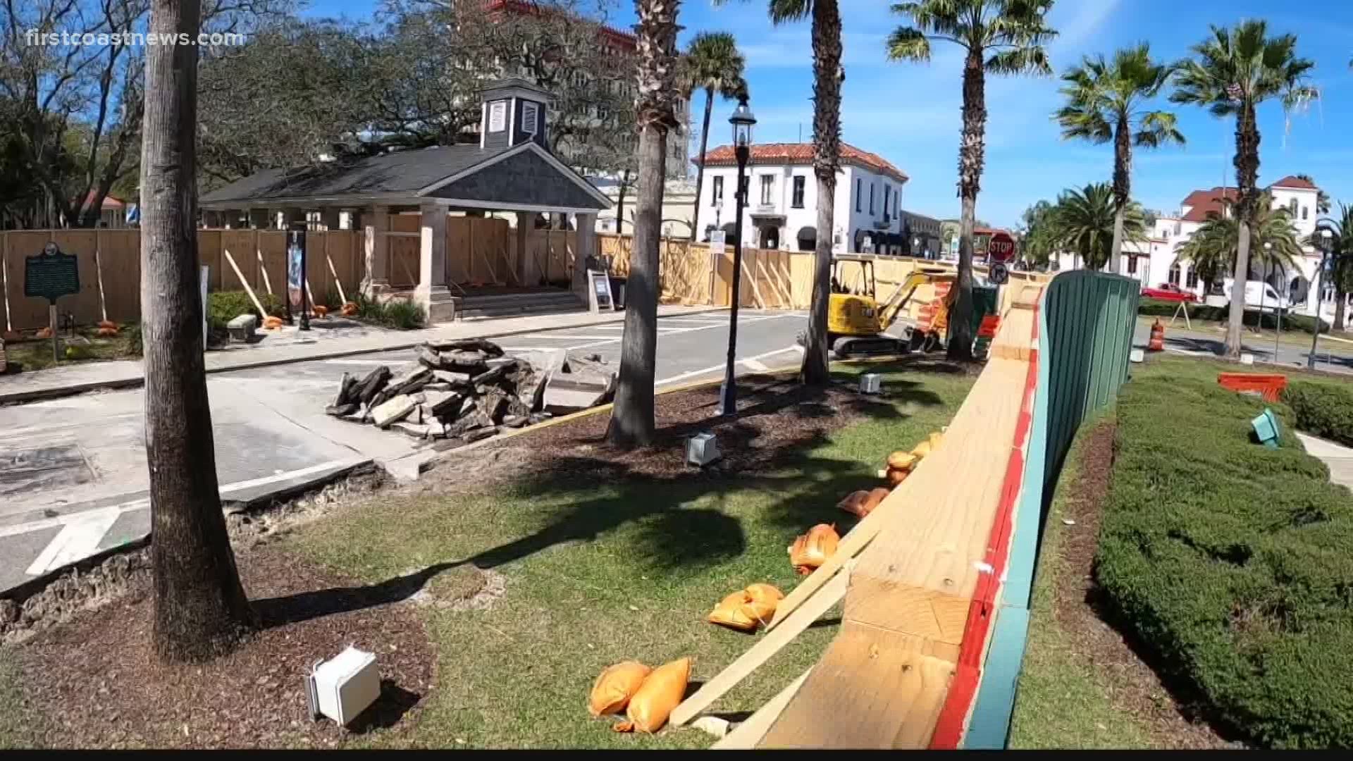 Big, green walls in downtown St. Augustine surround water project