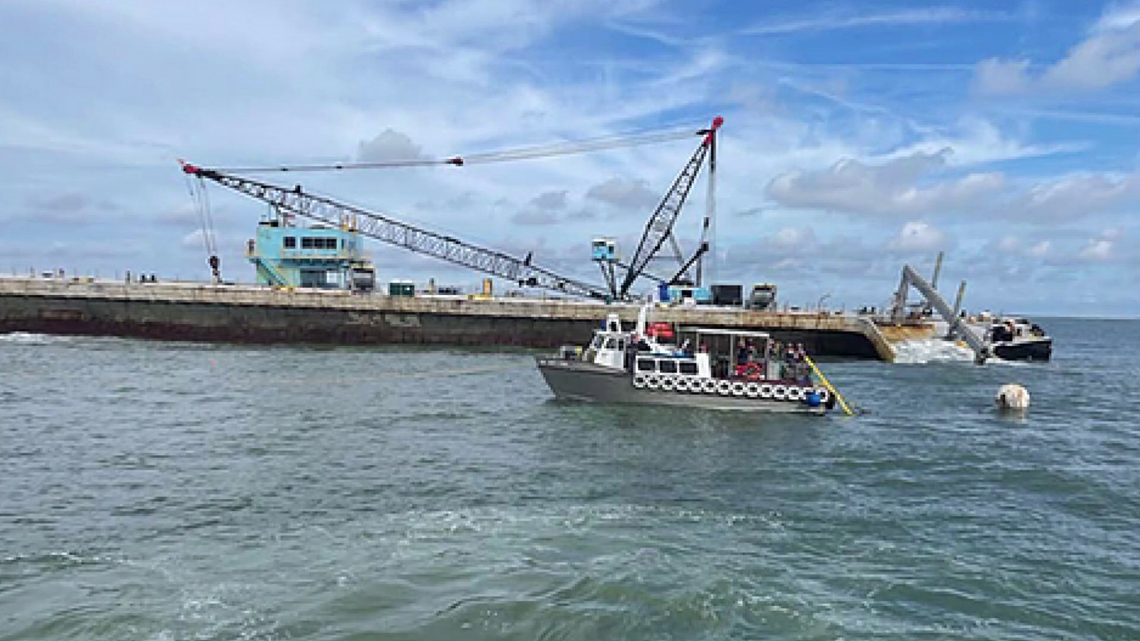 Beached barge loaded with hazardous waste in St. Johns River