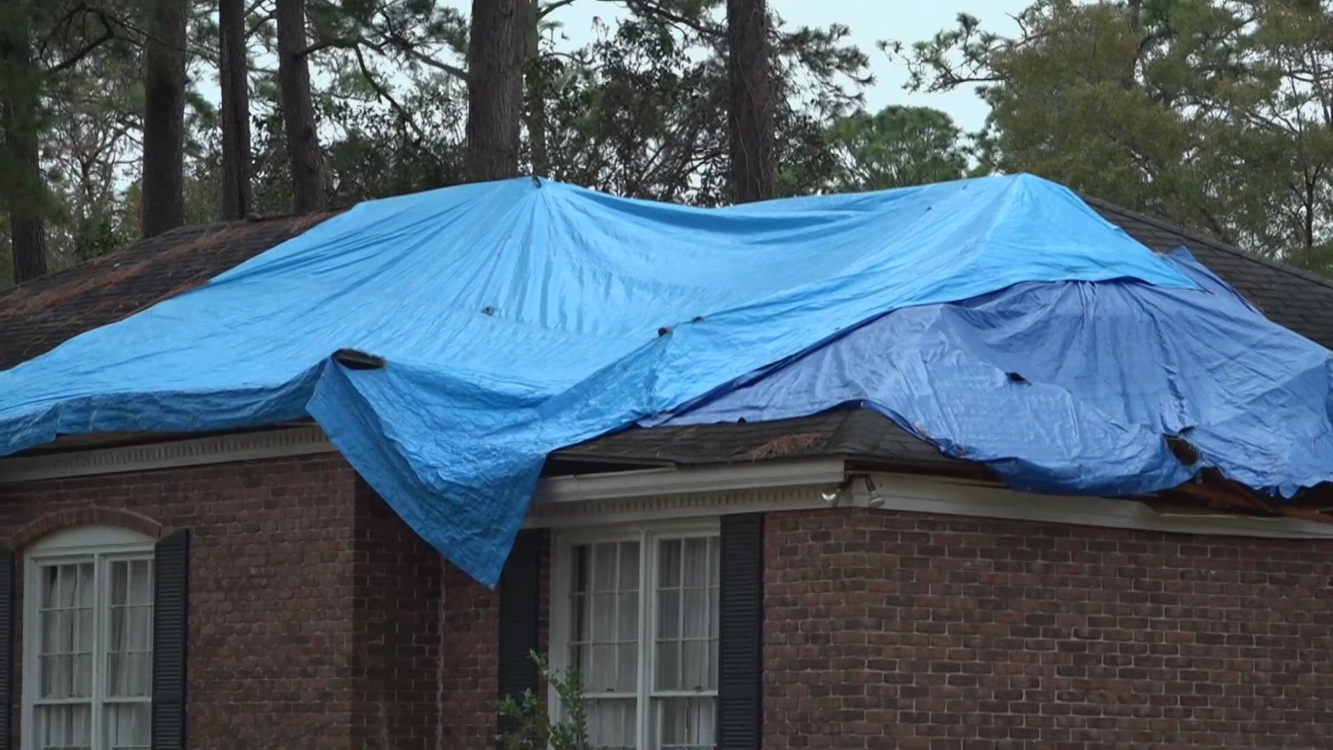 As people hang holiday decorations outside their homes, many homes in Waycross are still covered in tarps, recovering from the damages left behind by hurricanes.