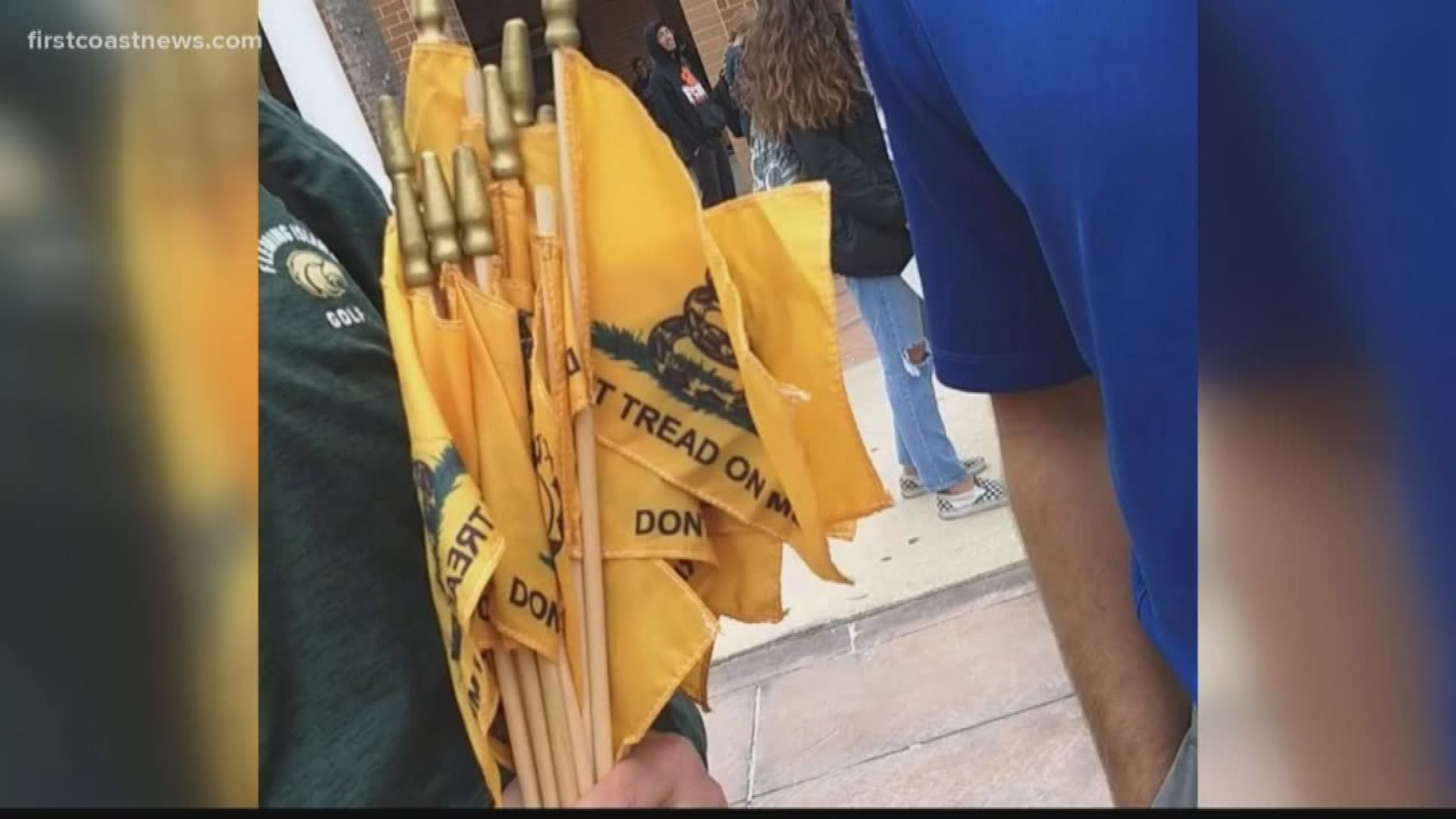 A student in Clay County is at the center of a controversy involving free speech after school officials confiscated flags she had during National School Walkout Day on Friday.