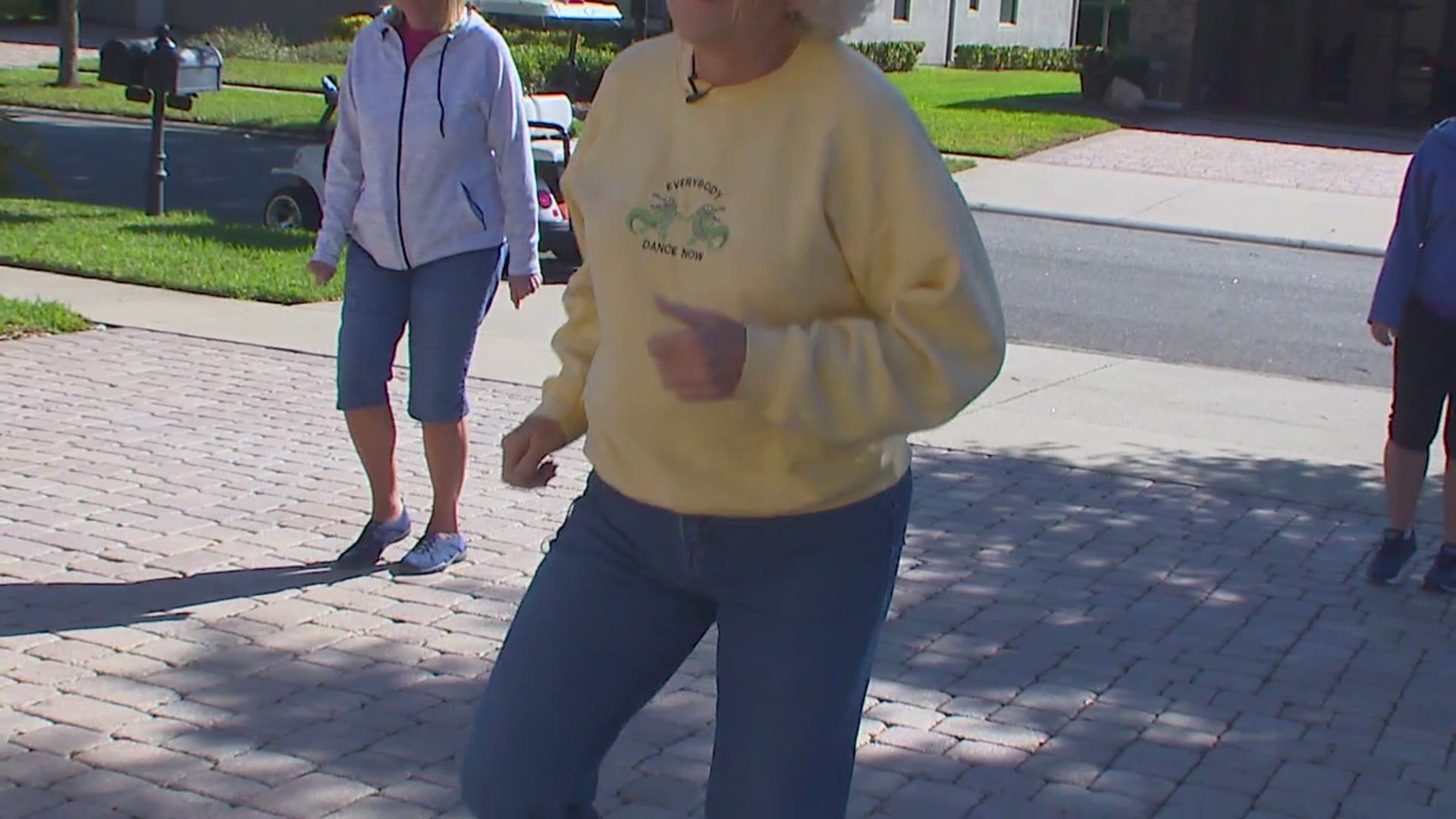 Cathy Florian taking advantage of the sunny mornings and fresh air by starting out every morning by dancing outside in her driveway and inviting neighbors to join.