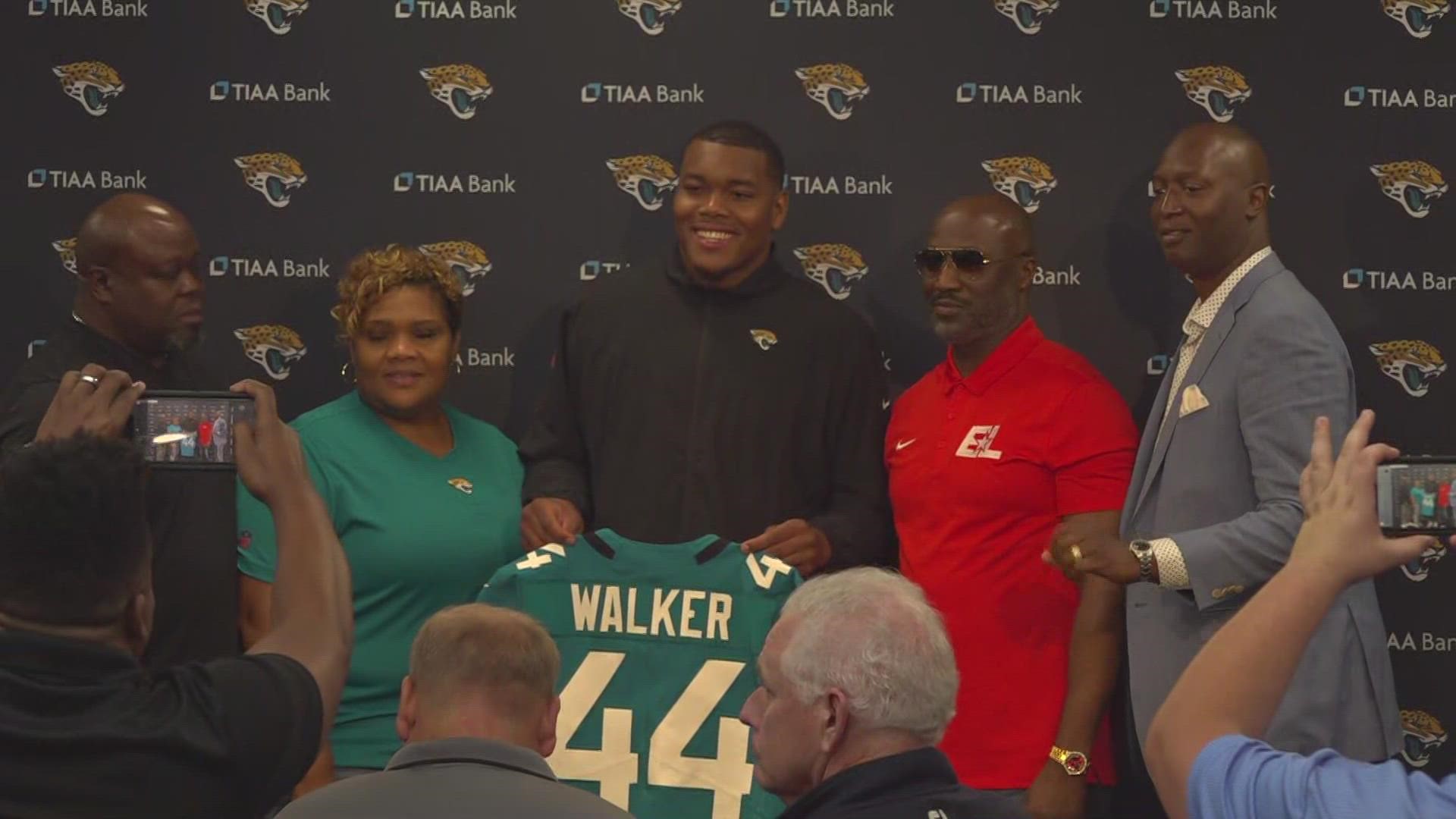 After addressing the media for the first time as a Jacksonville Jaguar, Travon Walker received his jersey and took some pics with his family.