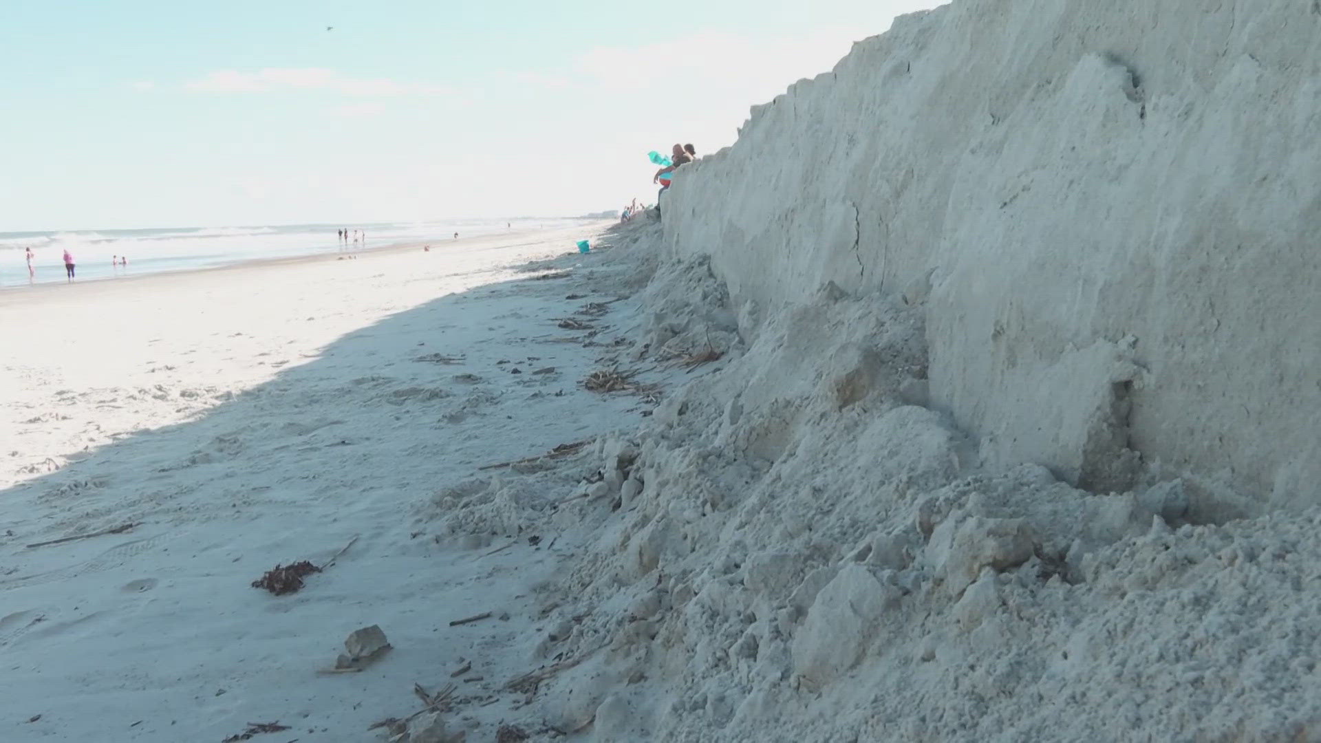 High tides on Fernandina Beach have left large sand cliffs, puzzling visitors and causing a potential safety hazard.