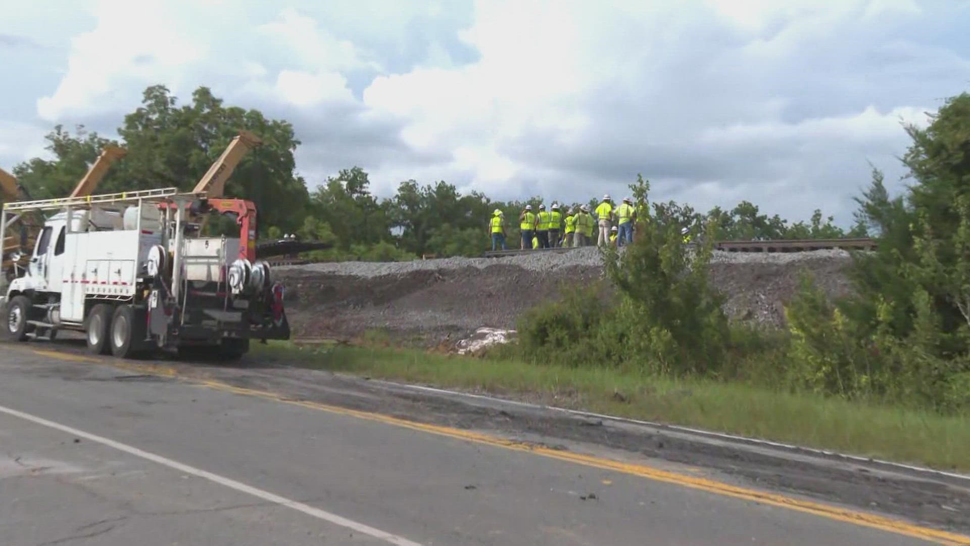 Crews are waiting on a new piece of track to be brought down.