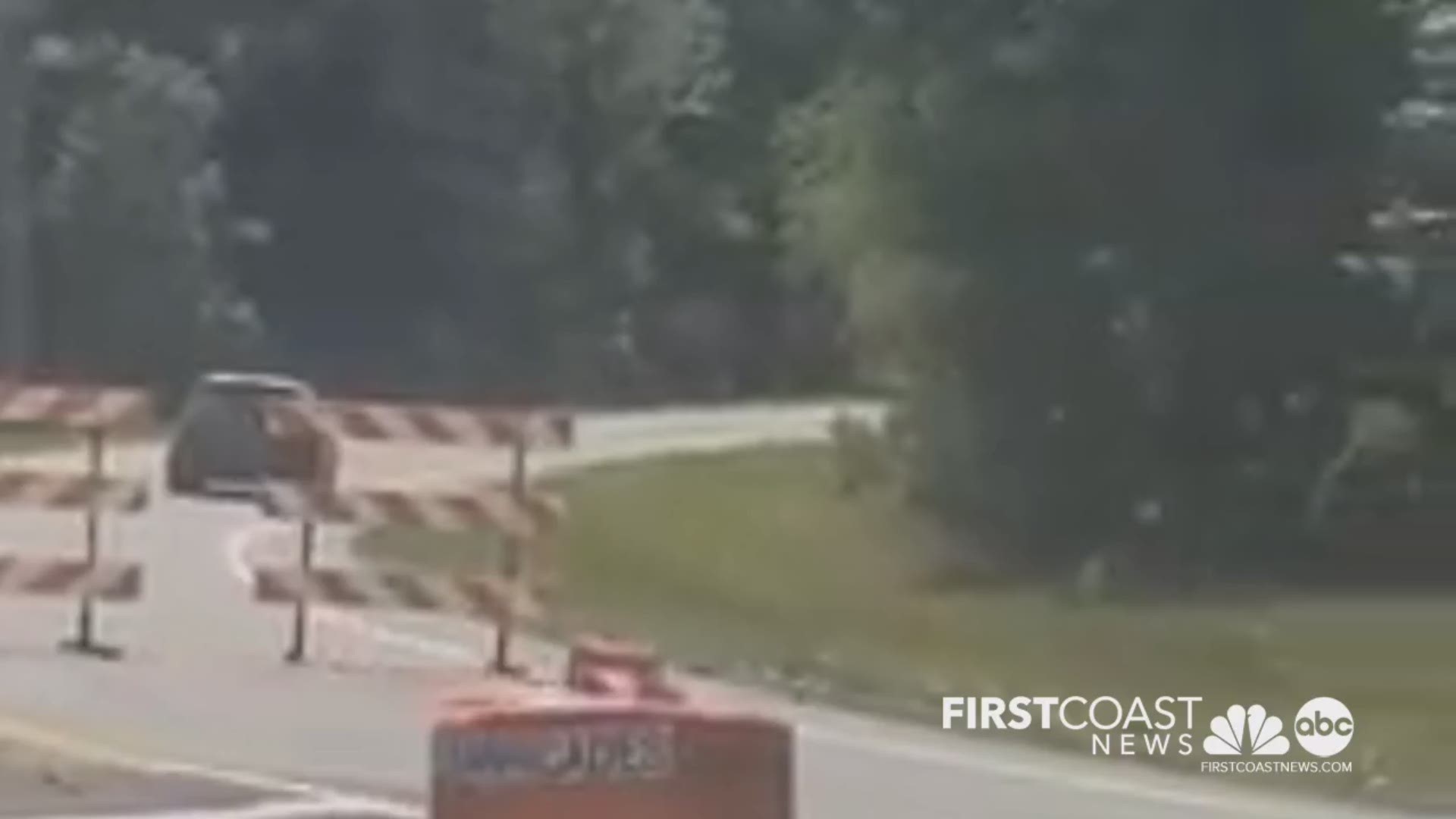 Video shared with First Coast News on Sunday showing motorist on I-95 driving south driving around barriers avoiding checkpoints for people entering the state.