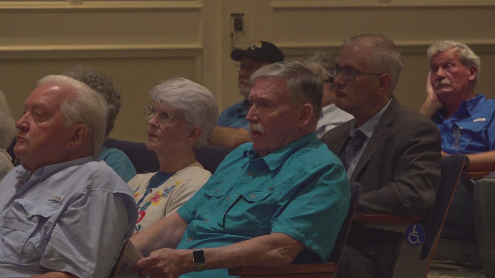 One neighbor said she was shaking with anger at Tuesday's meeting after a flub by the city's traffic department derailed a decision on the controversial project.