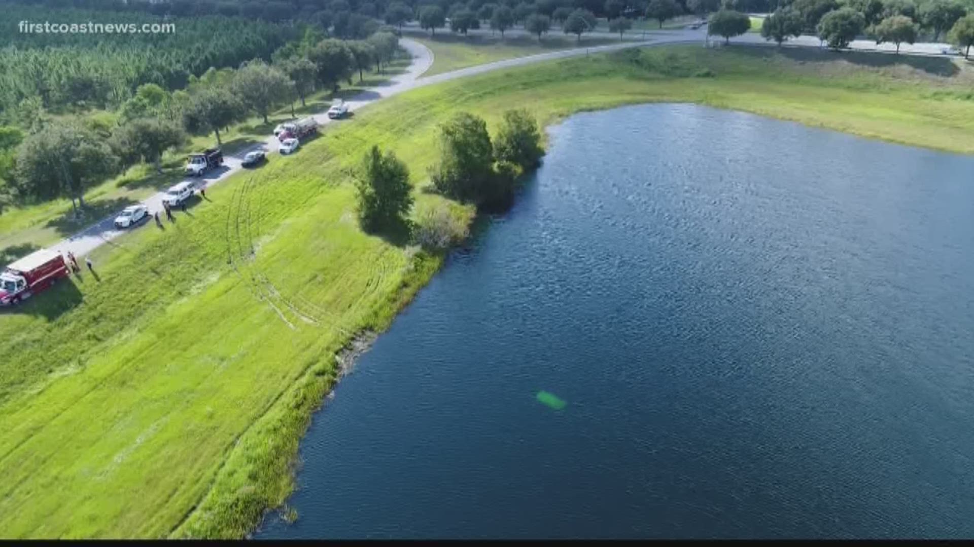 Two cars and a total of four people left the ramp from International Golf Parkway and ended up in a pond just after 4 p.m. on Monday.