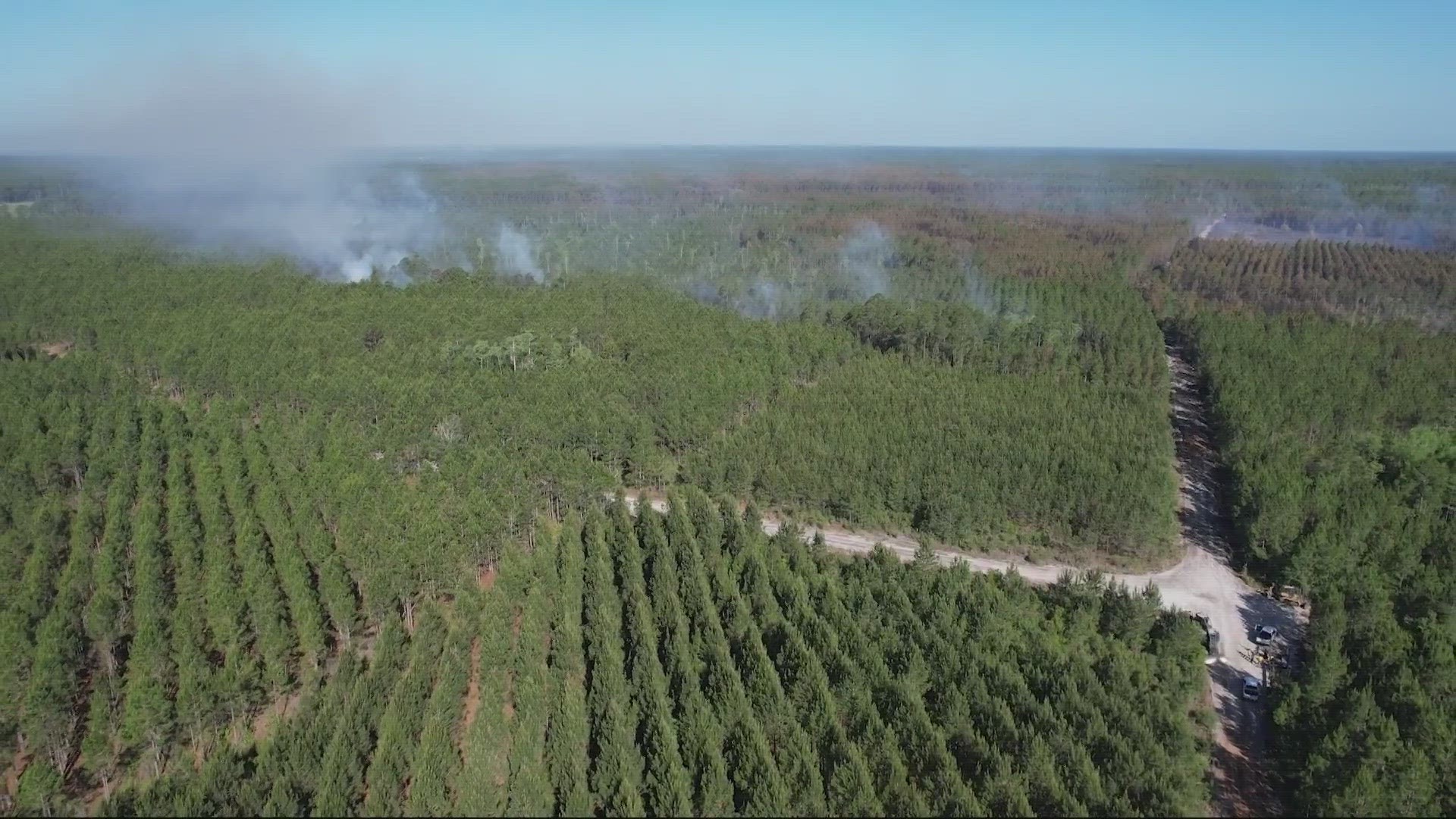 County Rd 121 Fire Crews continue to battle wildfire in Nassau County | firstcoastnews.com