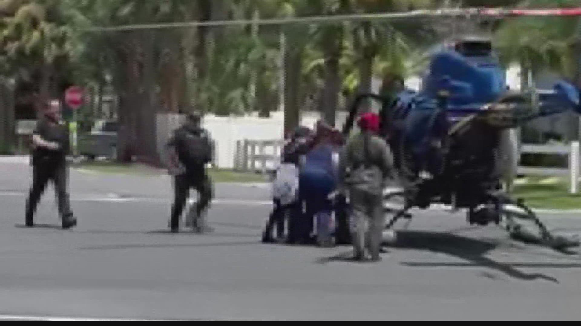 The helicopter touched down in the middle of the roadway in Jacksonville Beach. Video shows and veterinarian personnel rushed out to greet the gurney.