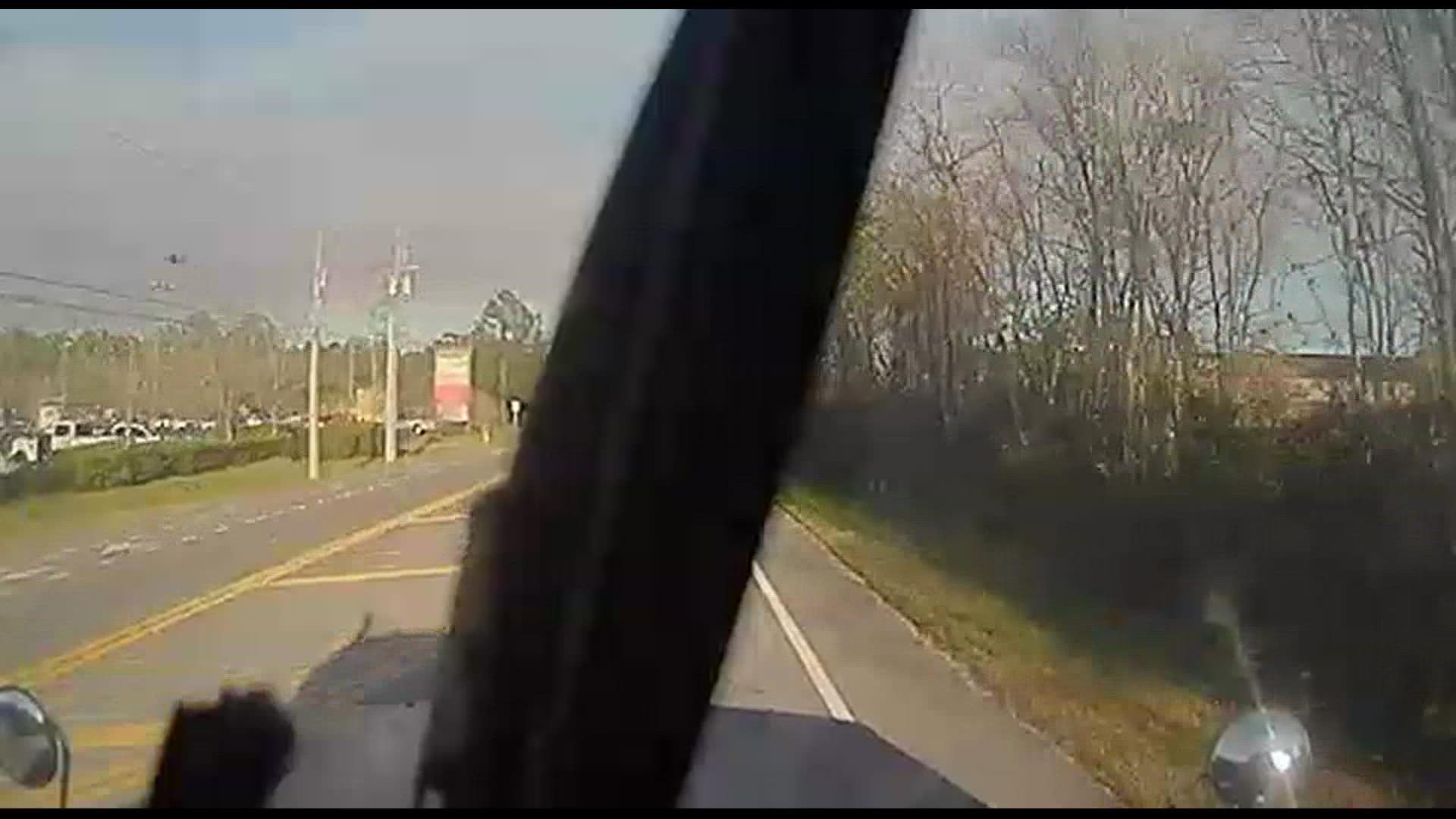 In the video, the truck hit a car that was making a left turn during a green light.