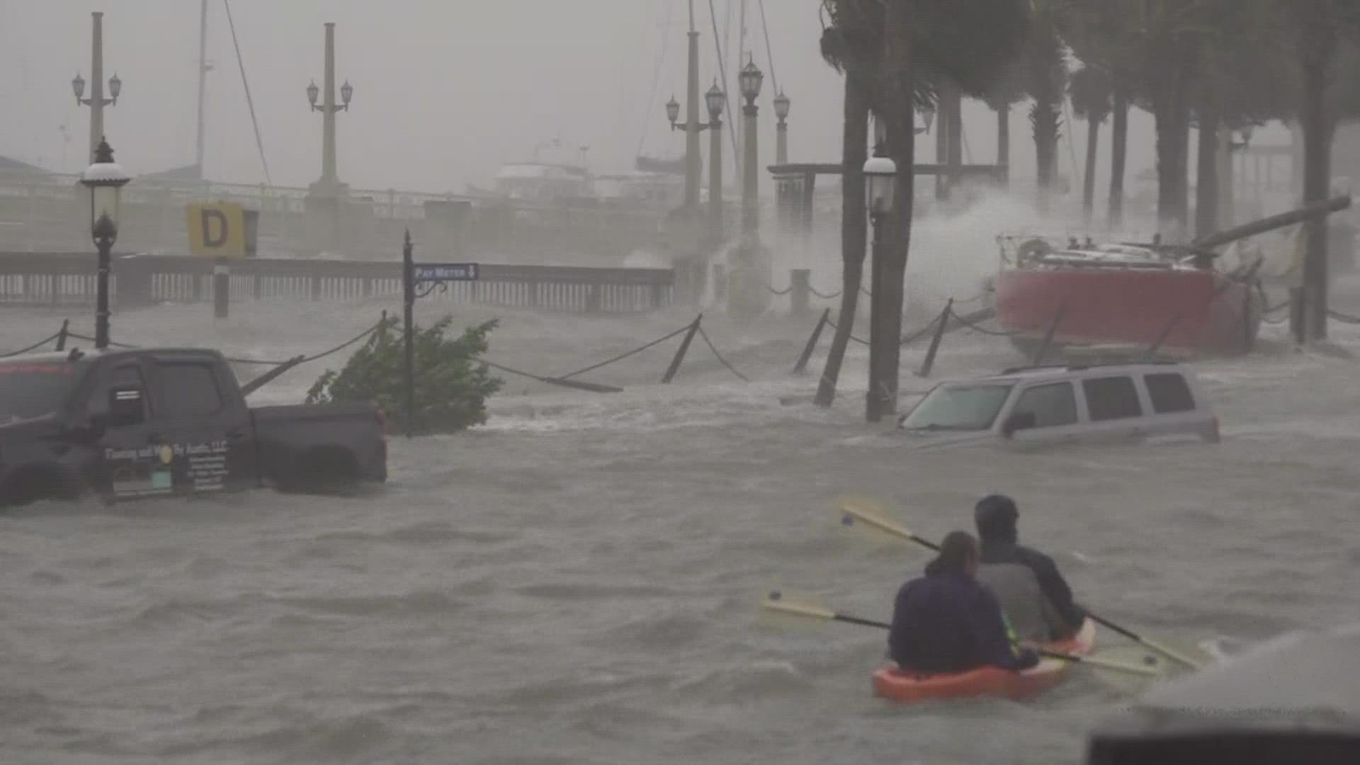 Submerged cars, destroyed boats and swift currents are hitting the St. Augustine coastline as peak high tide is pushing waters over the sea wall.