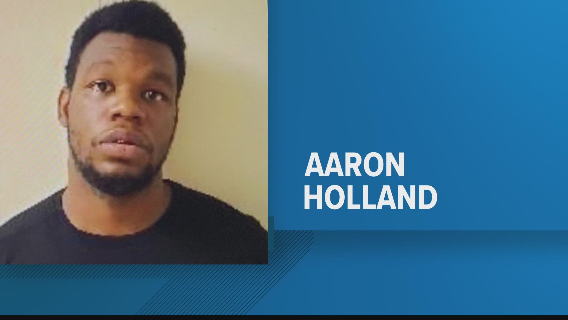 After speaking to witnesses, police discovered 23-year-old Aaron Holland was at a home when he opened fire from inside the bathroom.