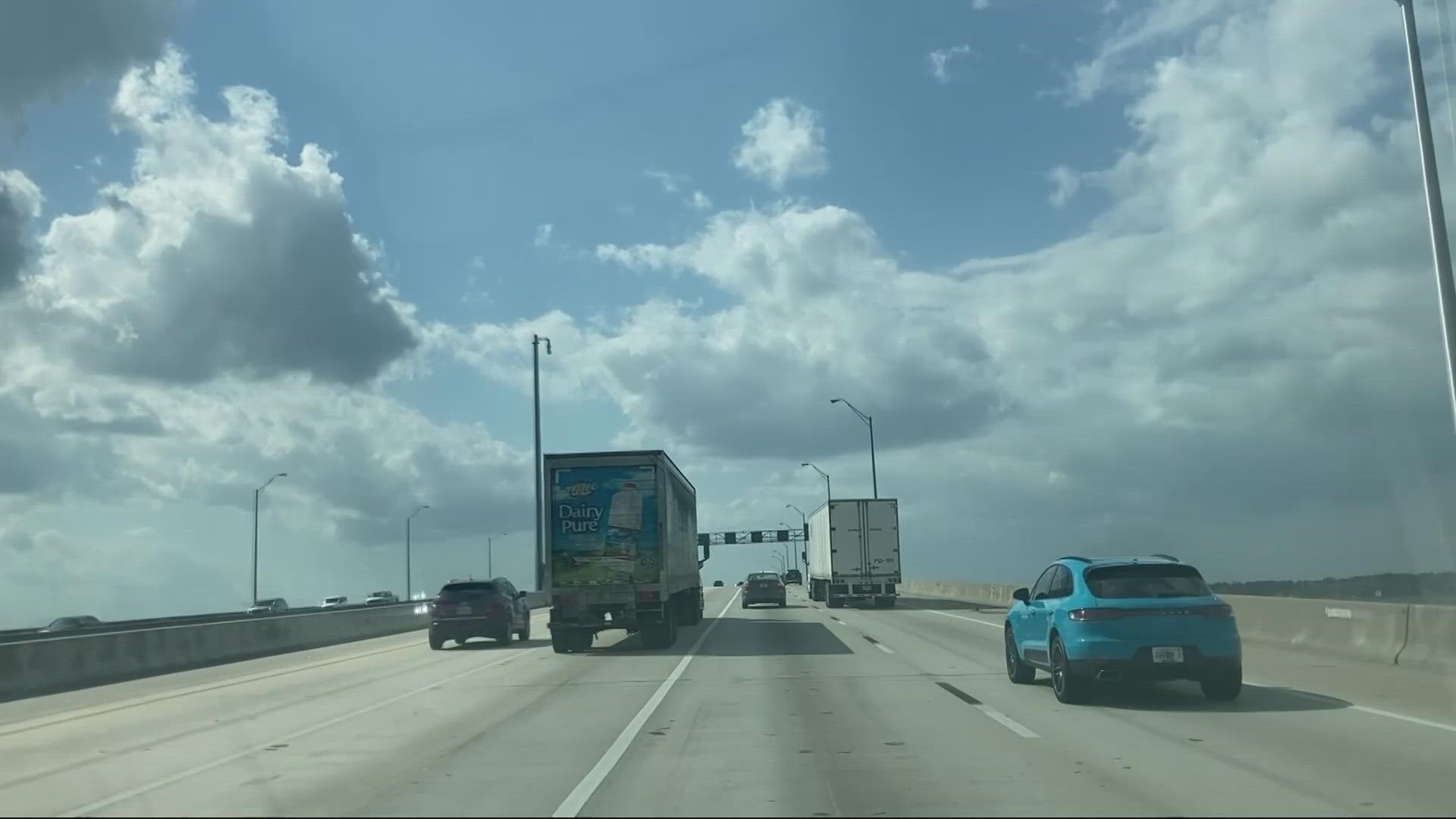 FHP says a collision occurred on the Buckman Bridge, sending one woman into the water.