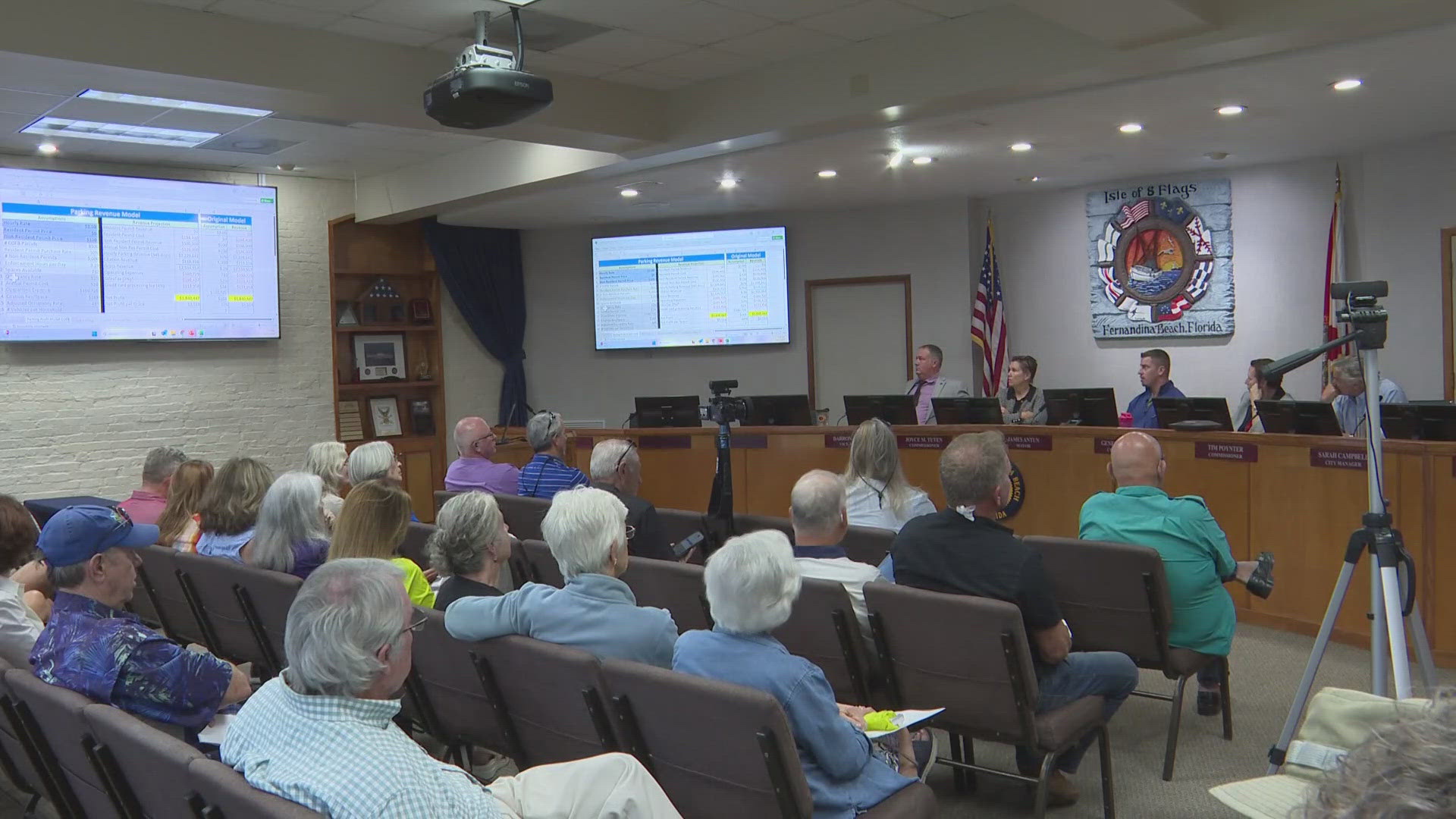 The fight over paid parking in downtown Fernandina Beach continues as some clash over a plan while city commissioners want to push forward without a public vote.