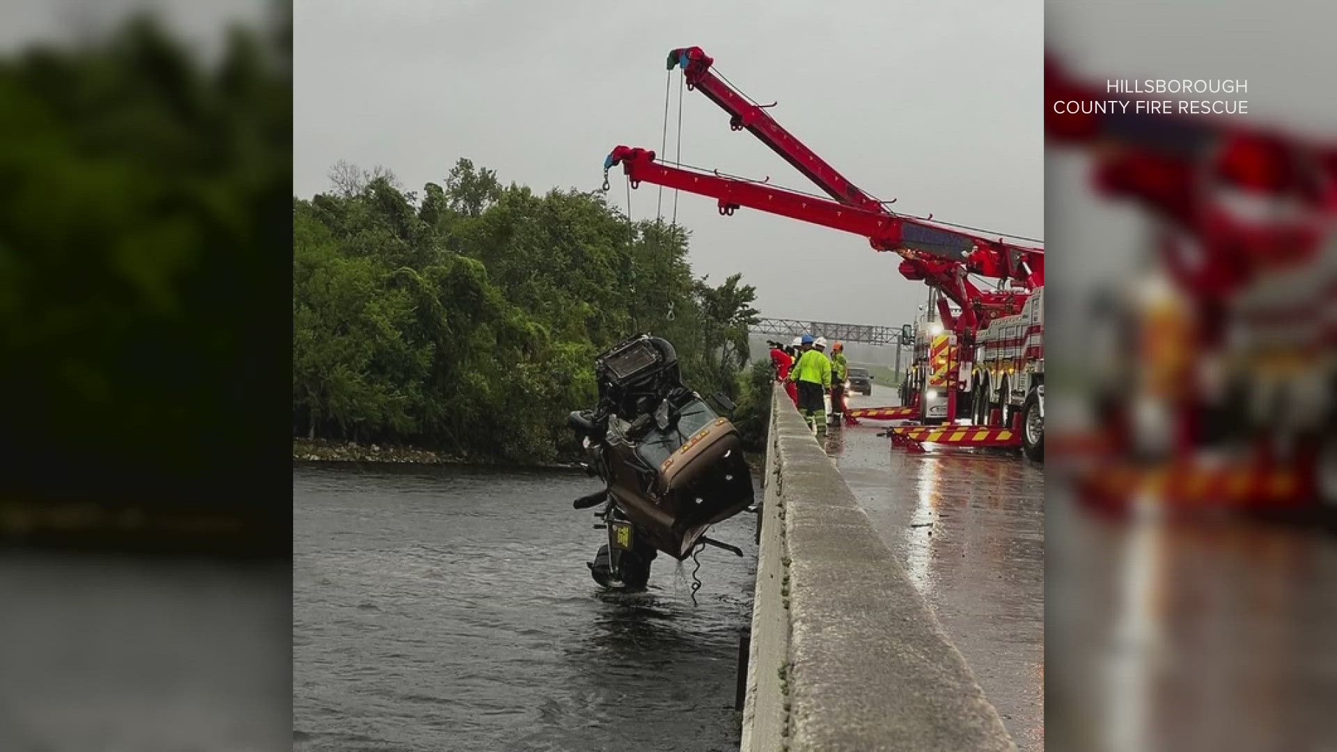 The 18-wheeler was hanging off the guard rail when rescue crews first got to the scene, but now the cab is submerged, officials say.