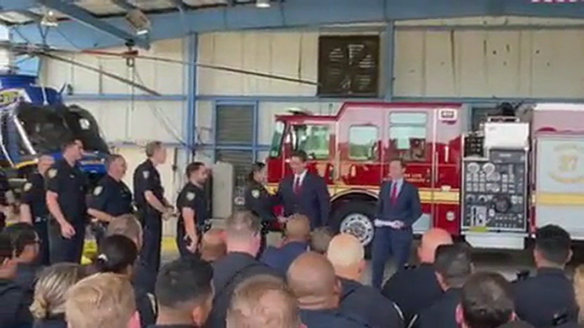 Gov. DeSantis hands out bonuses to Jacksonville first responders during press conference Monday afternoon.
Credit: Atyia Collins