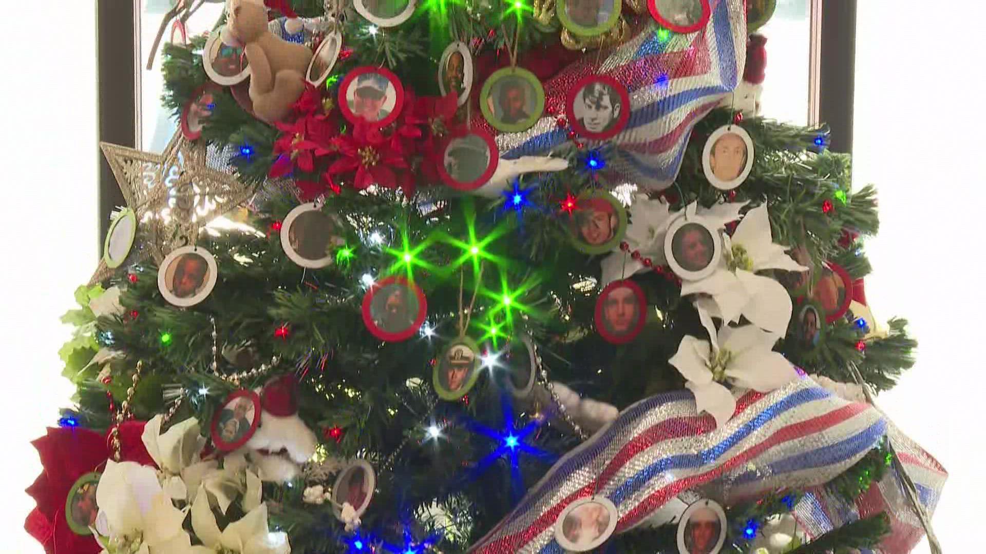 NAS JAX will decorate the tree with photo ornaments of 70 fallen service members.