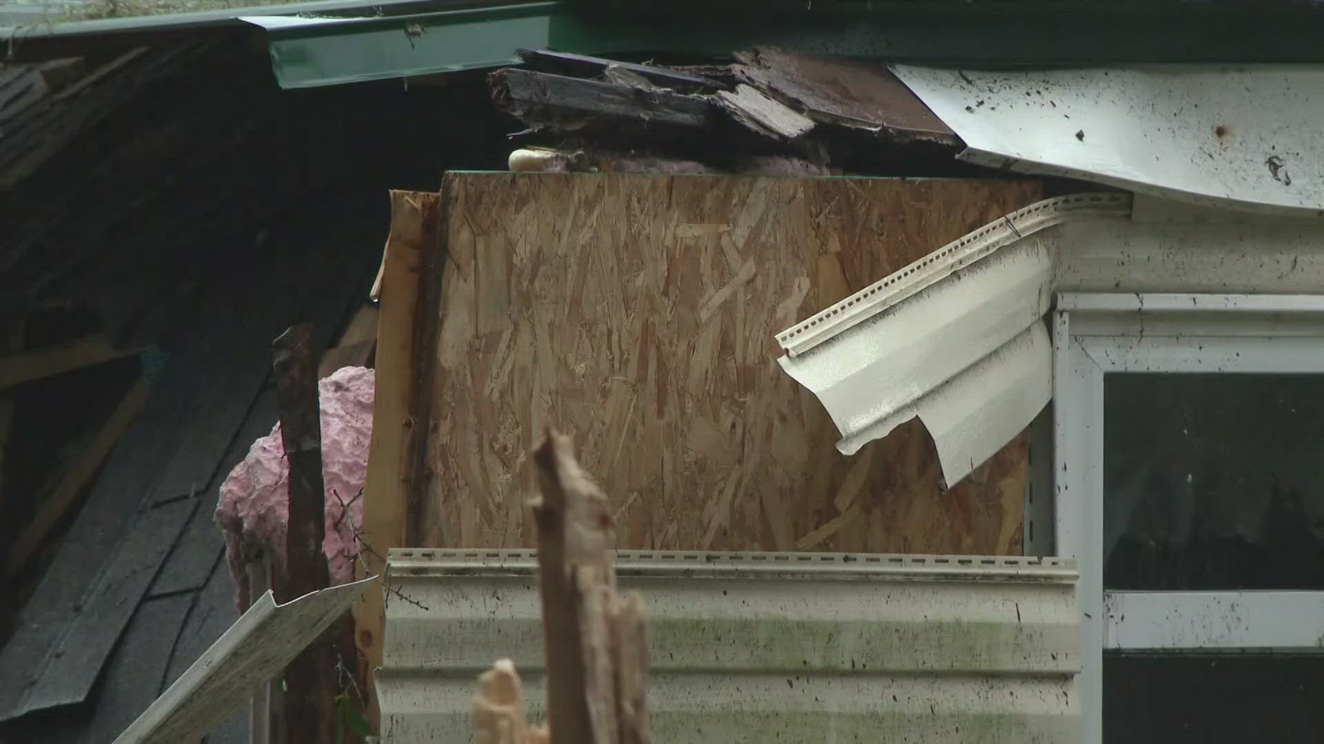 A tree crashed through a Baker County home while debris was littered throughout the county.